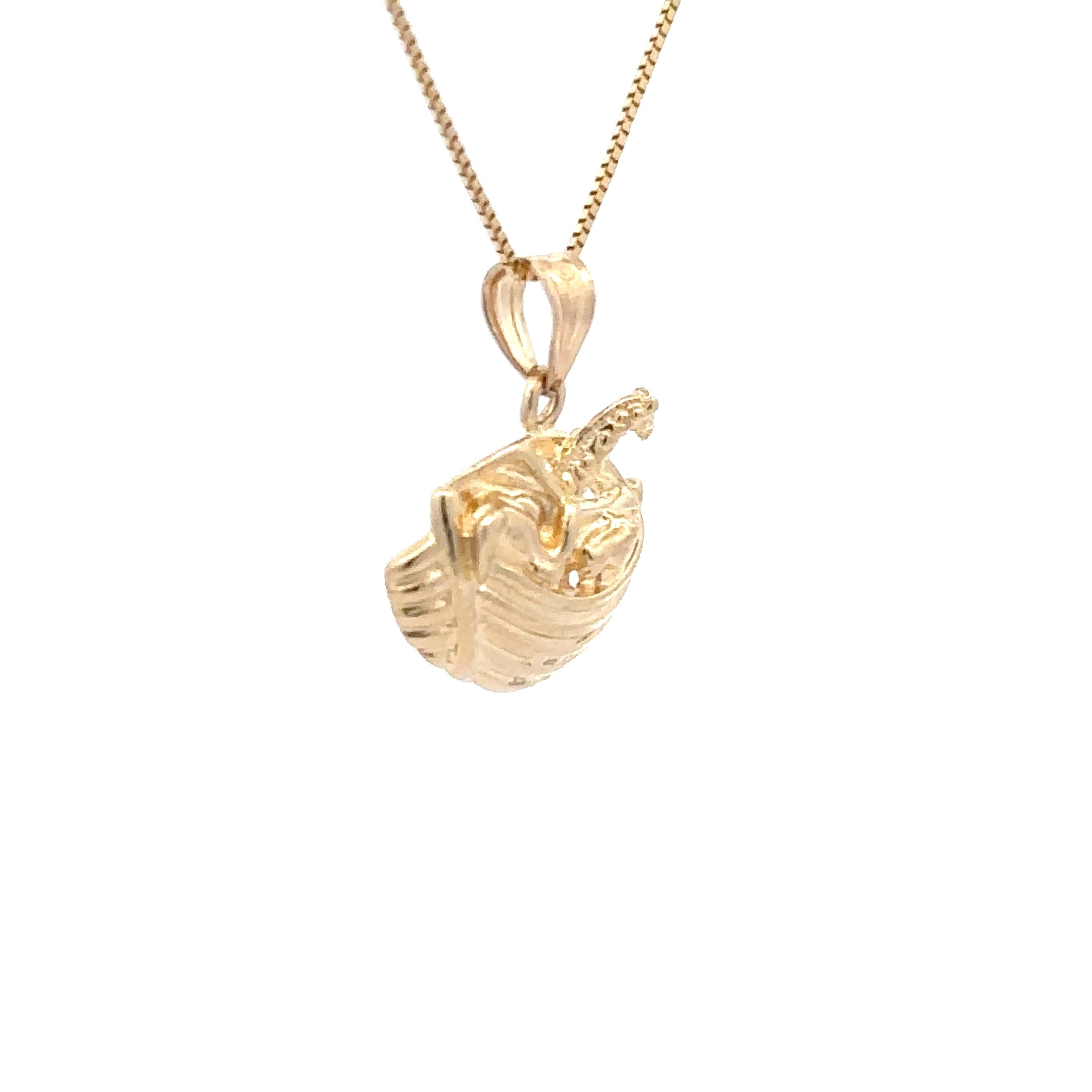 Gold necklace with a boat-shaped pendant on a white background