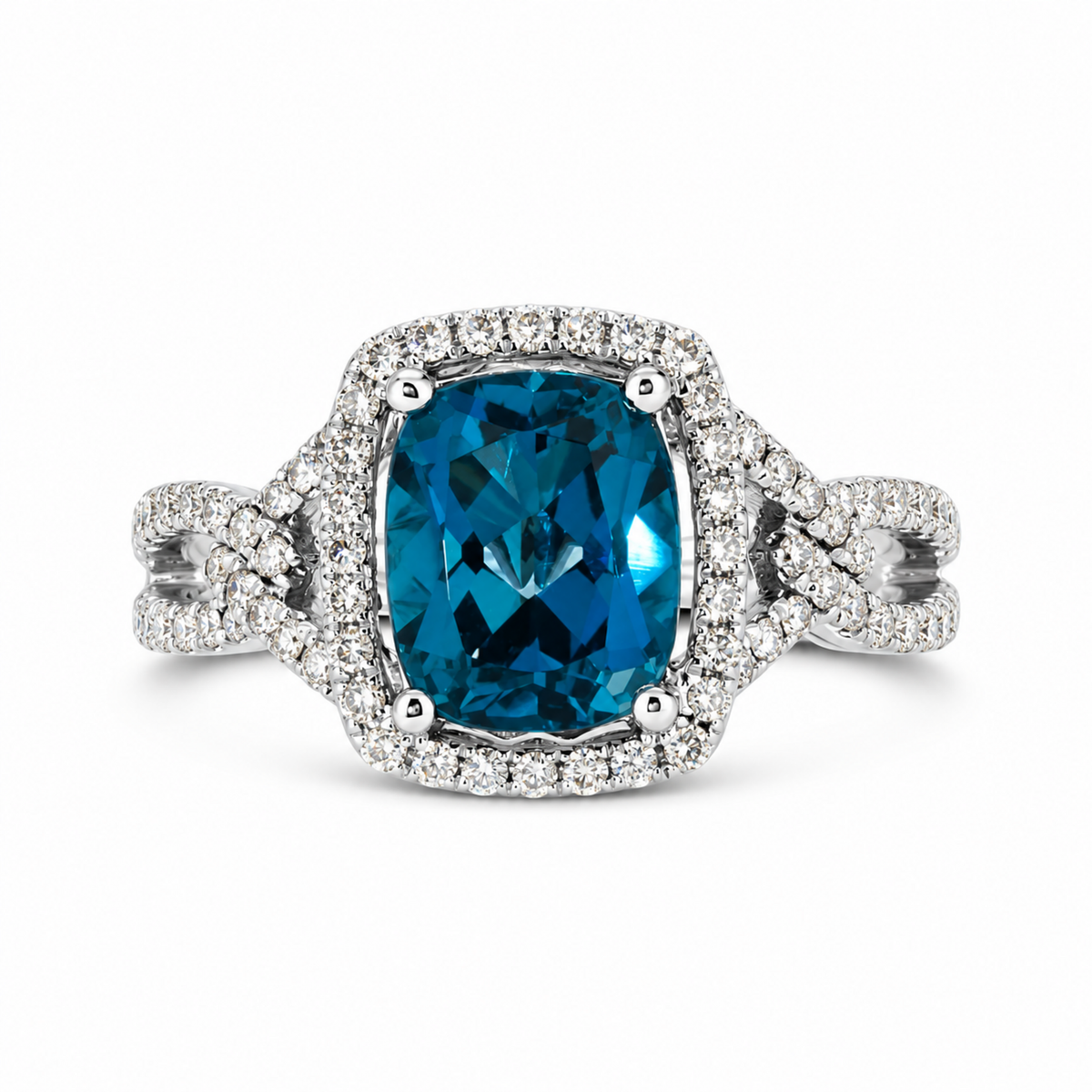 Front view of estate Le Vian 14K Vanilla Gold ring with elongated cushion London Blue Topaz, diamond halo and linked split shank.
