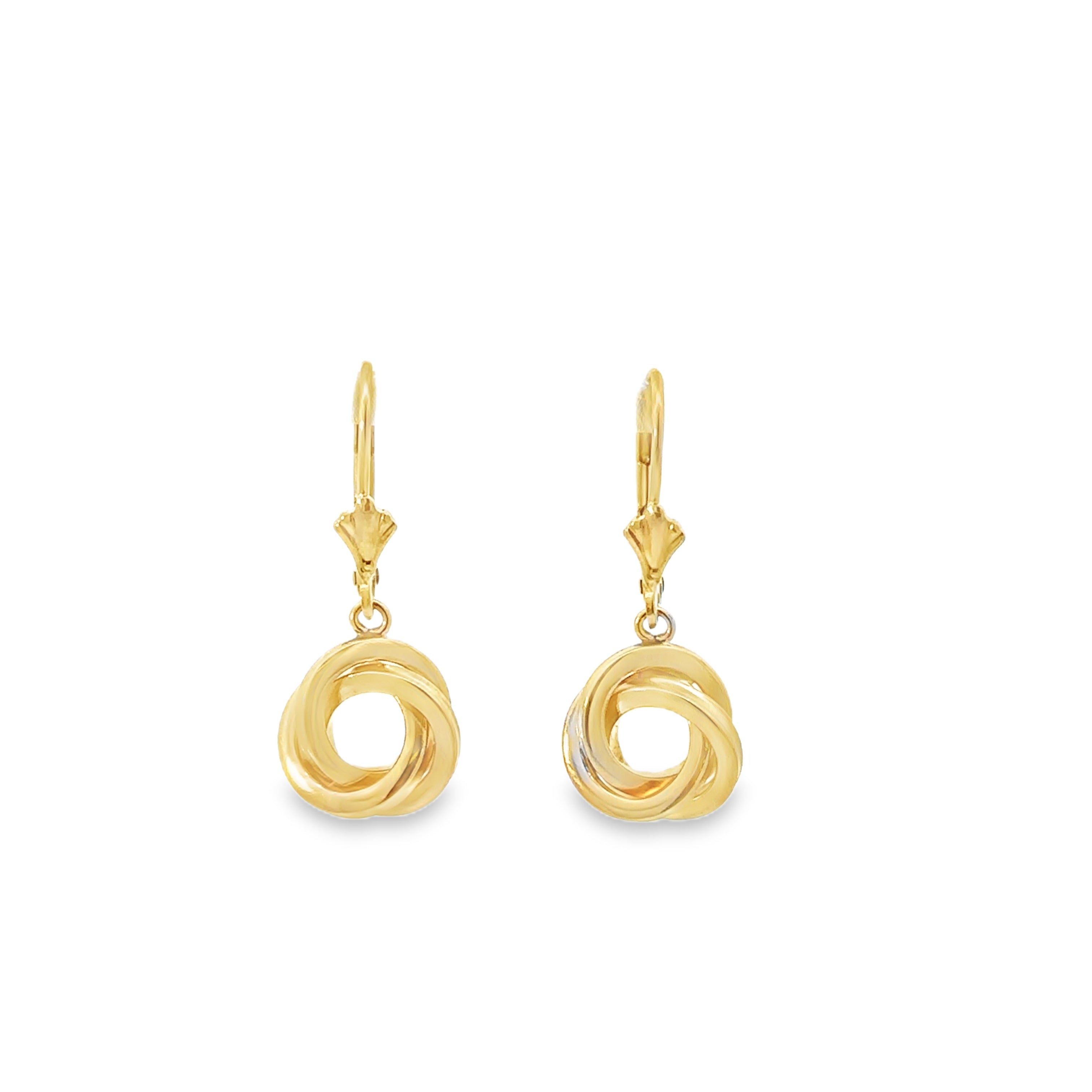 gold dangle earrings on white back ground