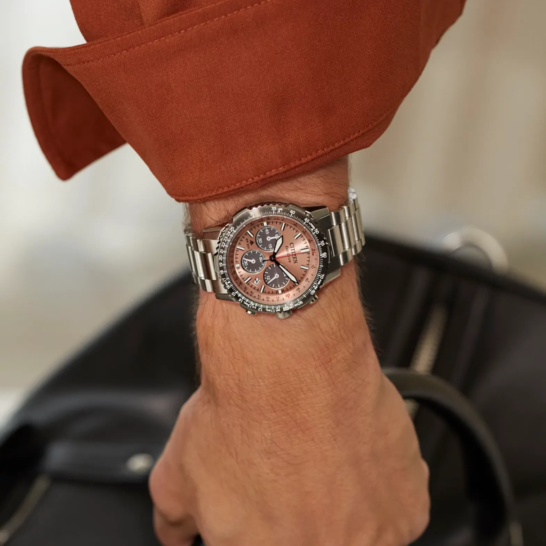 salmon citizen watch modeled on wrist