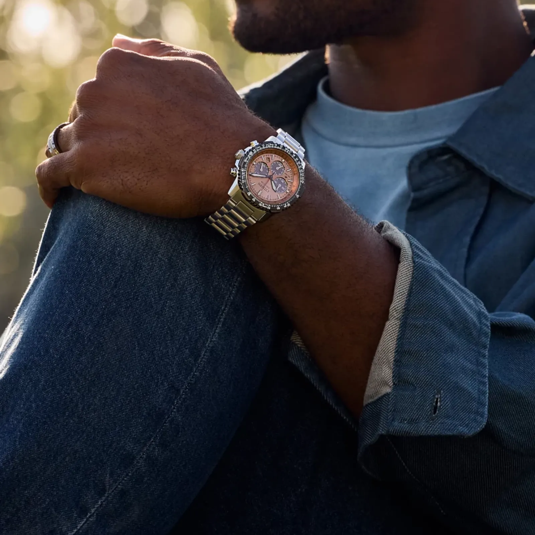 salmon citizen watch modeled on wrist