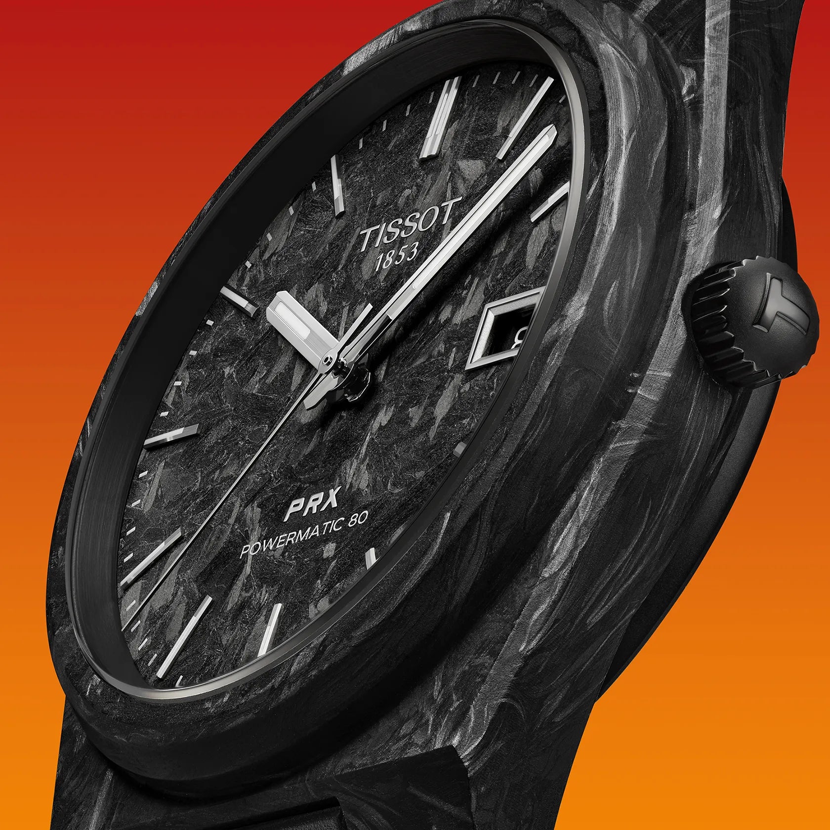 Black Tissot watch with detailed design on an orange background