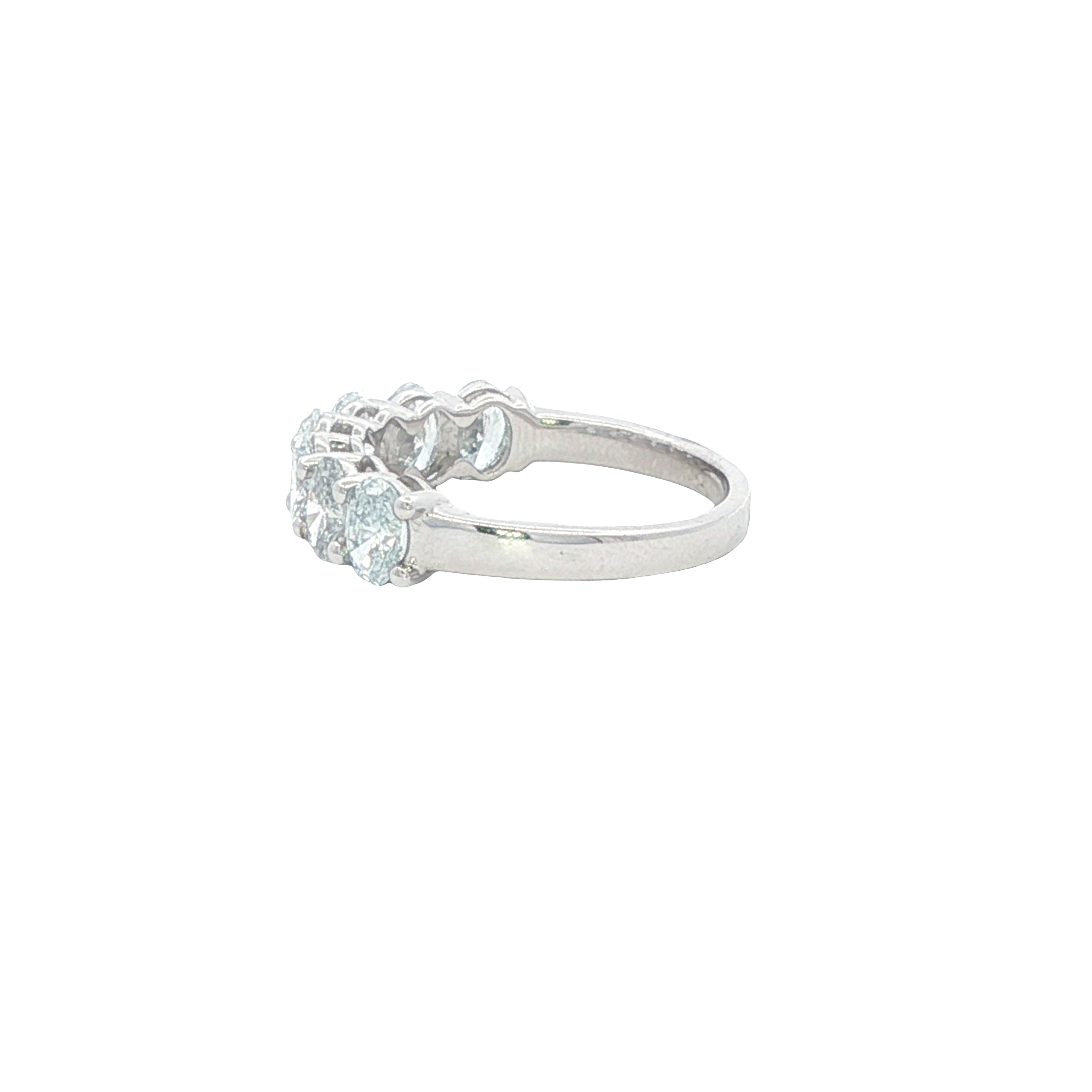 Silver ring with multiple gemstones on a white background