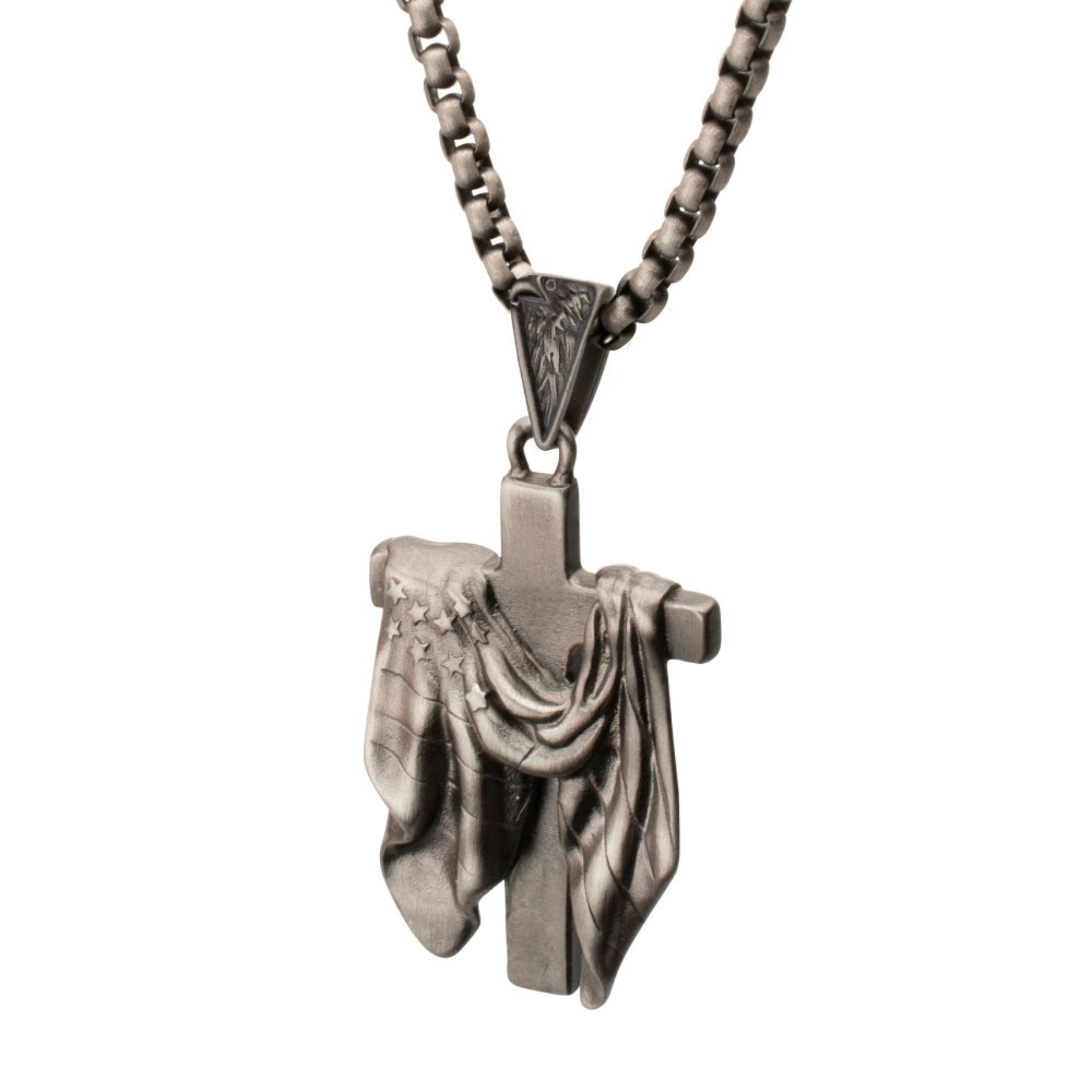Silver cross pendant with draped fabric on a white background