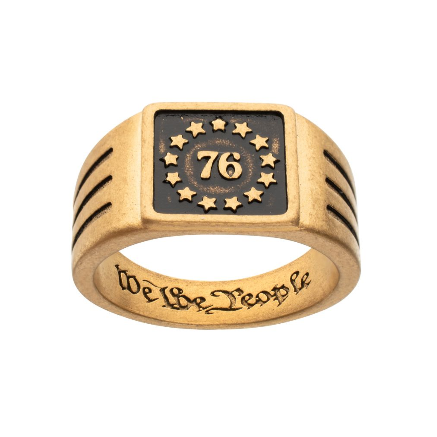 Gold ring with 'We The People' engraving and '76' design on a white background