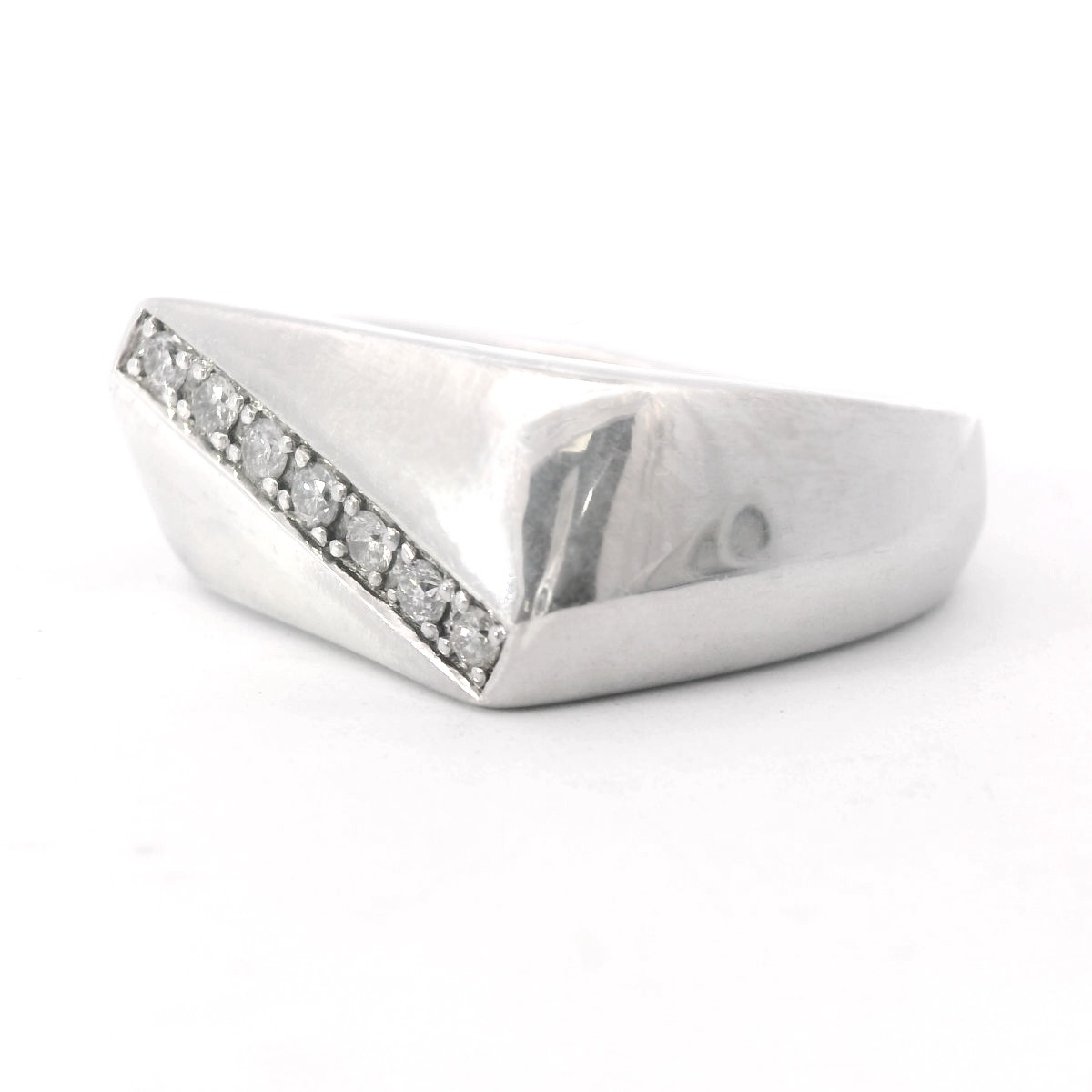 Angled to the left view of Sterling Silver Men's Diamond Wedding Ring laying flat on a white background.