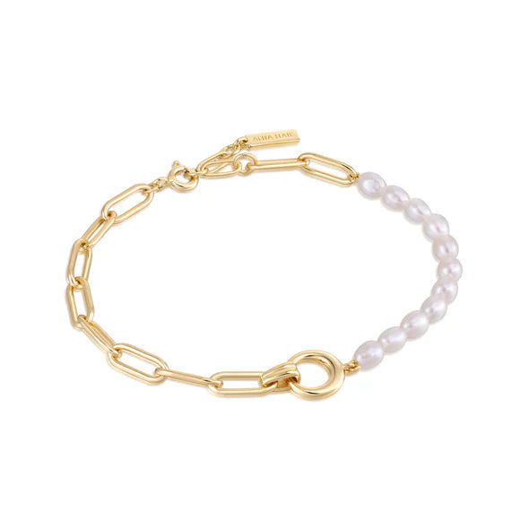 Half gold link and pearl bracelet on a white background