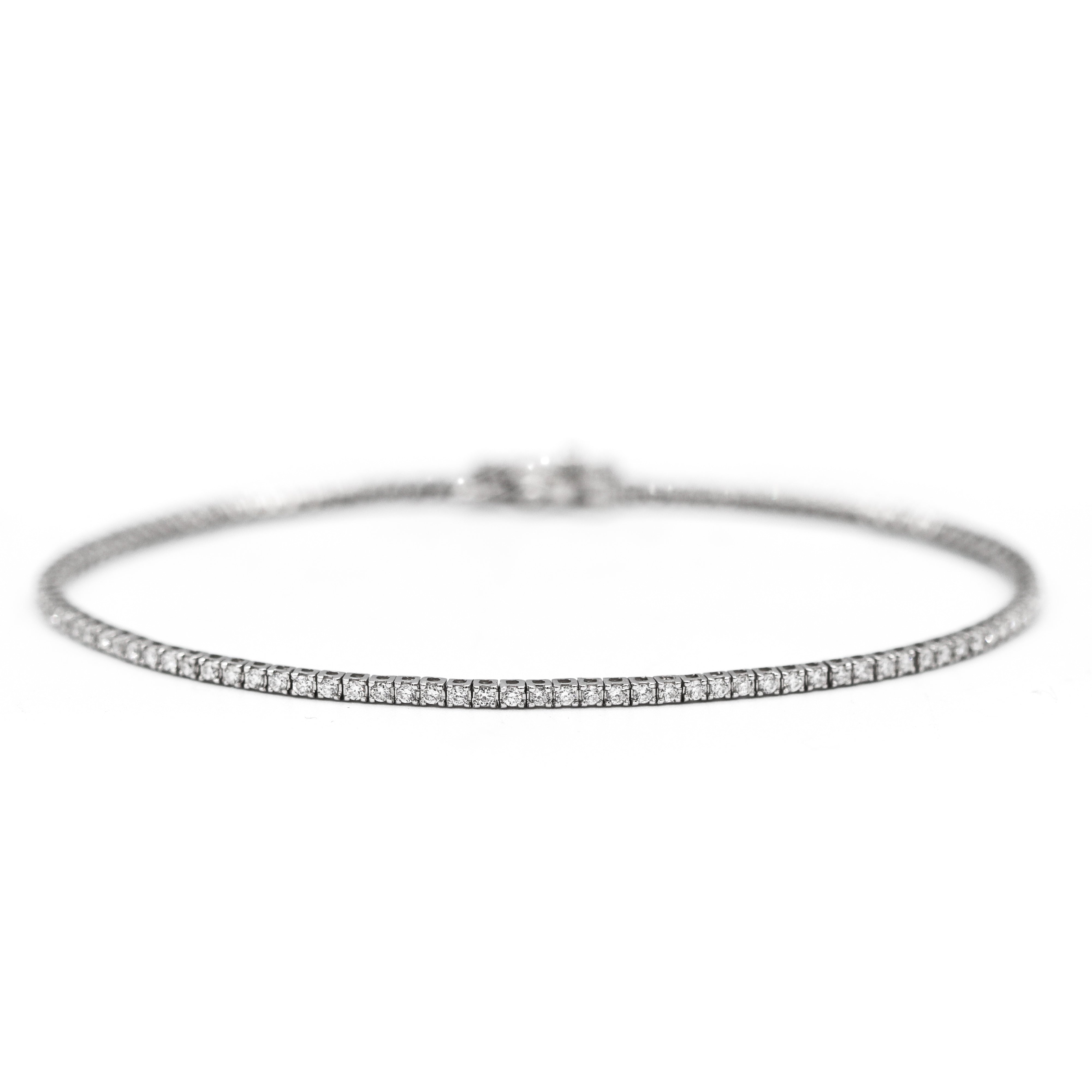 Side view zoomed out of 14K White Gold 1CTW. Lab-Grown Diamond Tennis Bracelet on a white background.