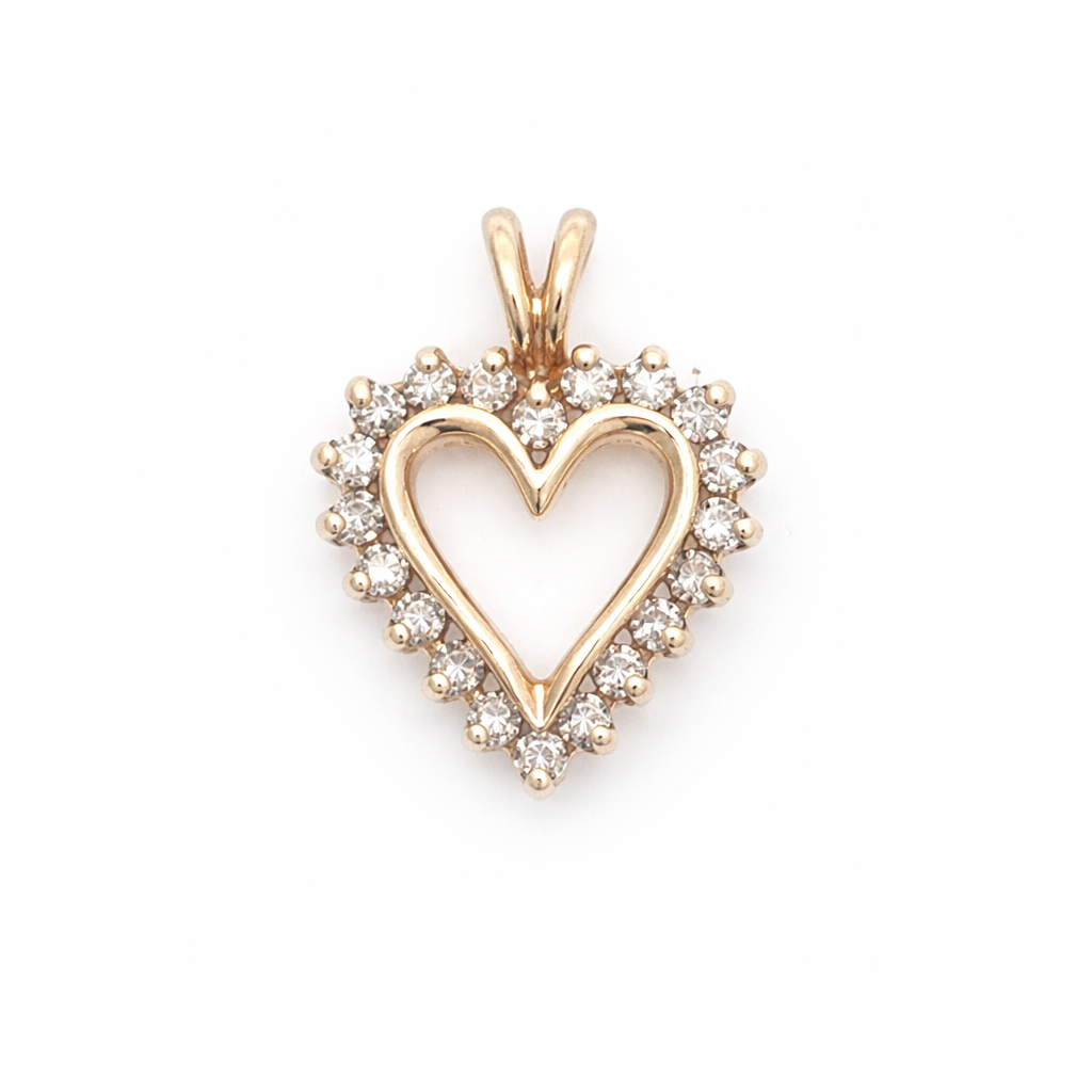 Gold heart-shaped pendant with diamonds on a white background
