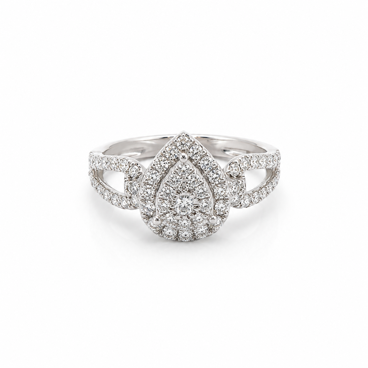 Silver ring with teardrop design and diamond accents on a white background
