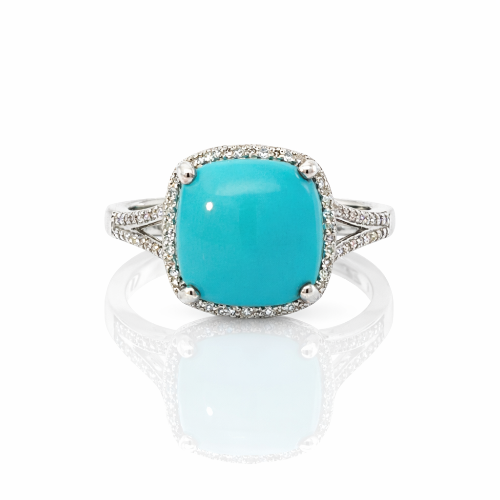 Turquoise ring with silver band on a white background