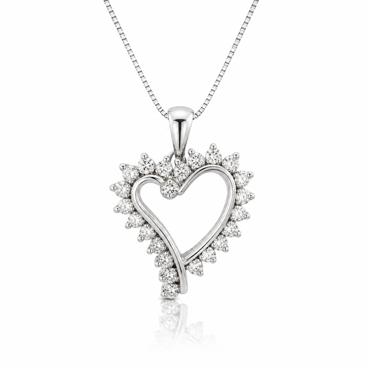 A silver heart-shaped pendant necklace adorned with small clear stones, suspended from a delicate box chain on a white background.