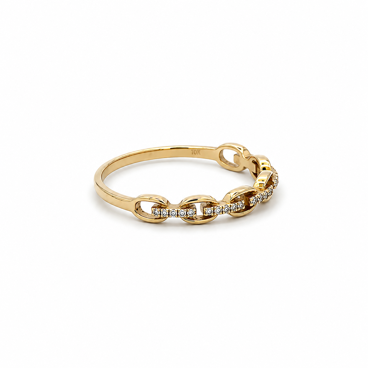 A yellow gold chain-link ring with a row of small clear stones along the front, photographed on a clean white background.