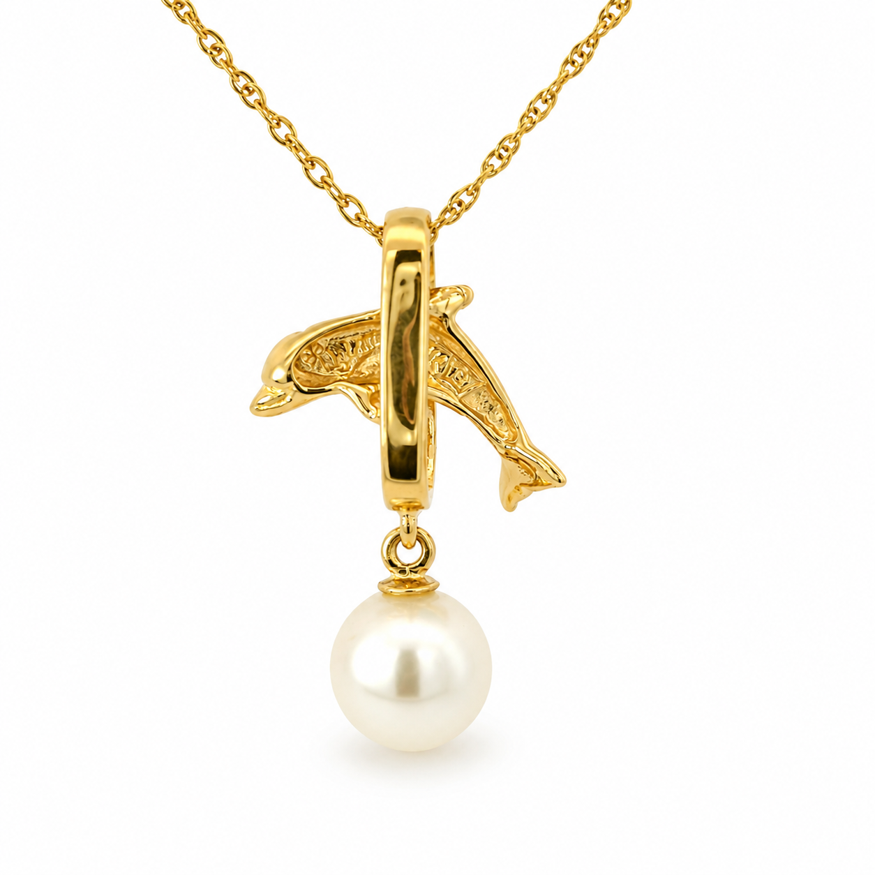 Gold dolphin pendant necklace with a dangling white pearl on a clean white background.