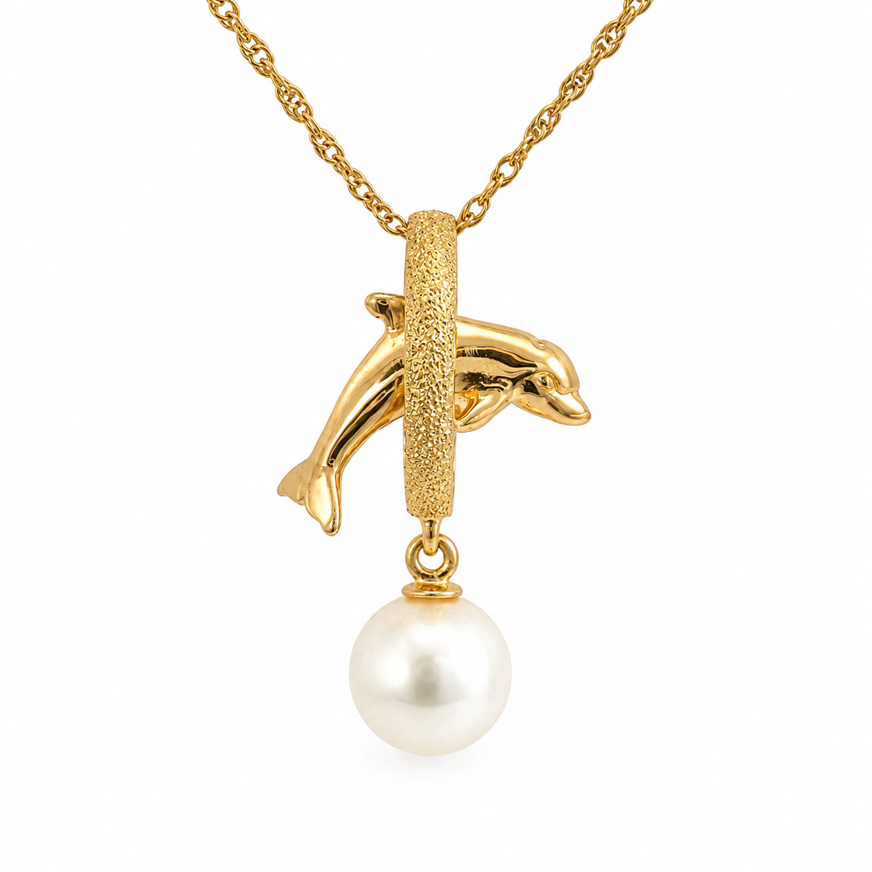 Gold-tone necklace featuring a dolphin-shaped pendant suspended from a textured vertical bar, with a dangling white pearl, shown on a white background.