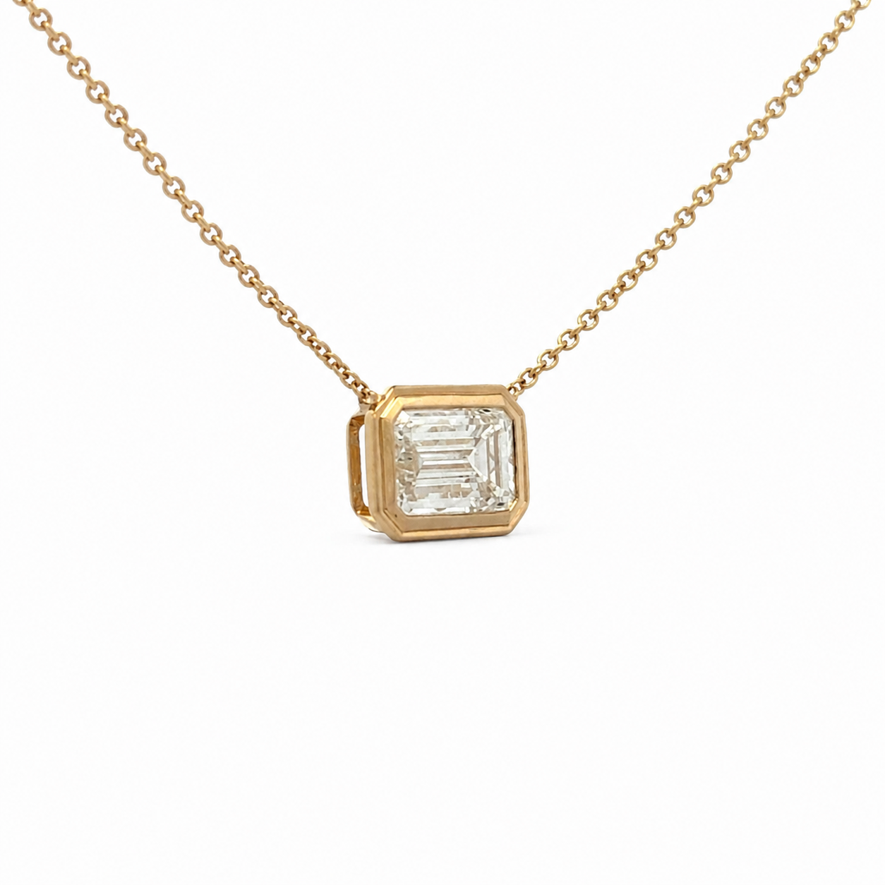 Emerald Cut Solitaire Diamond necklace on a white background