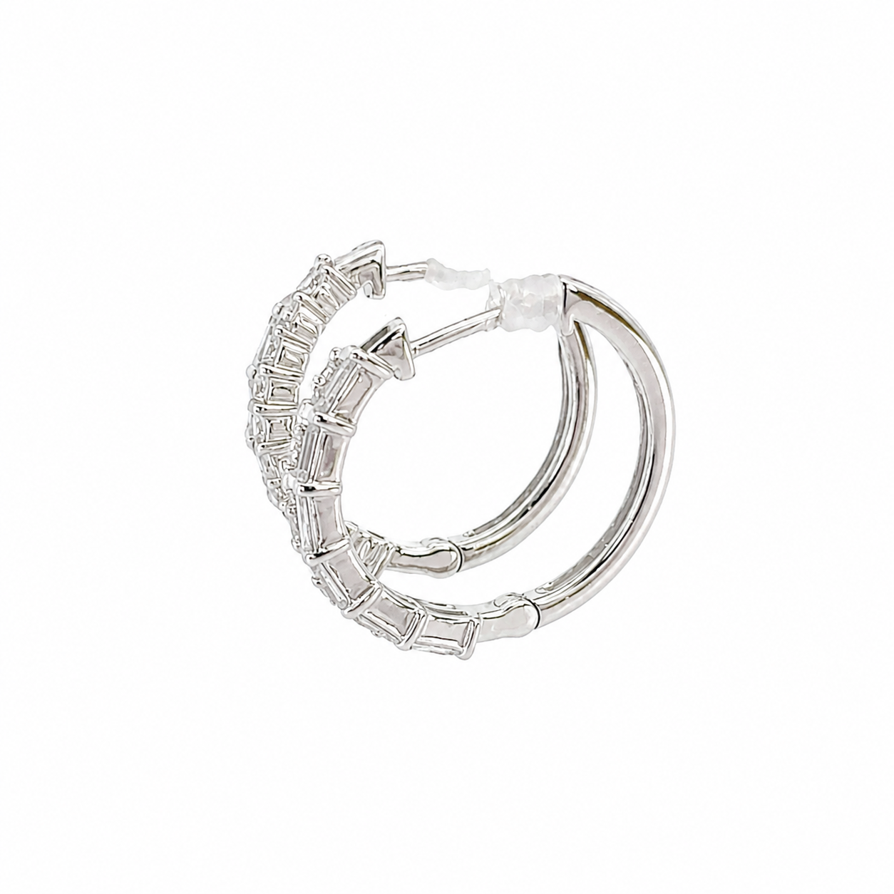 Side view of hoop earrings on a white background