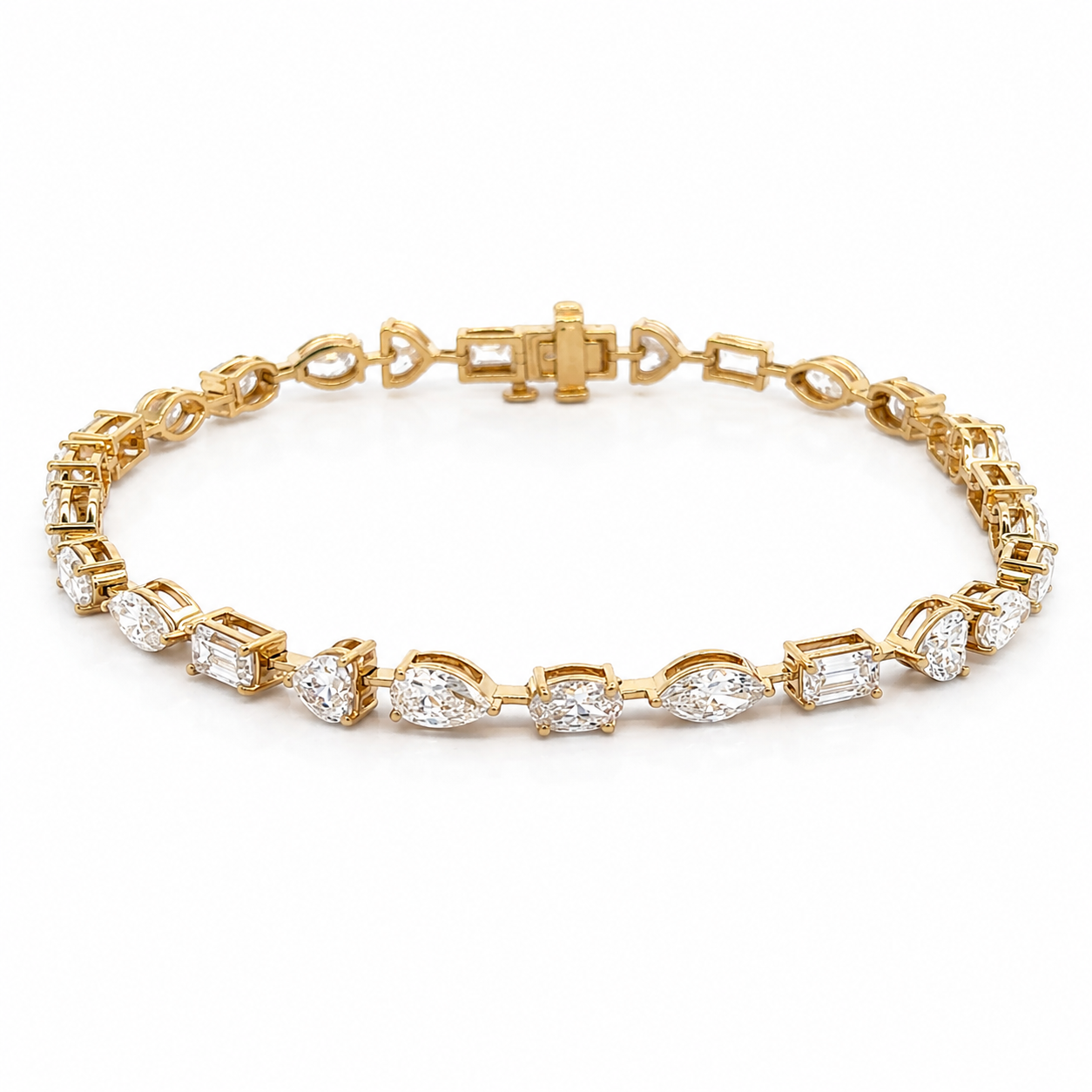 Gold tennis bracelet on a white background
