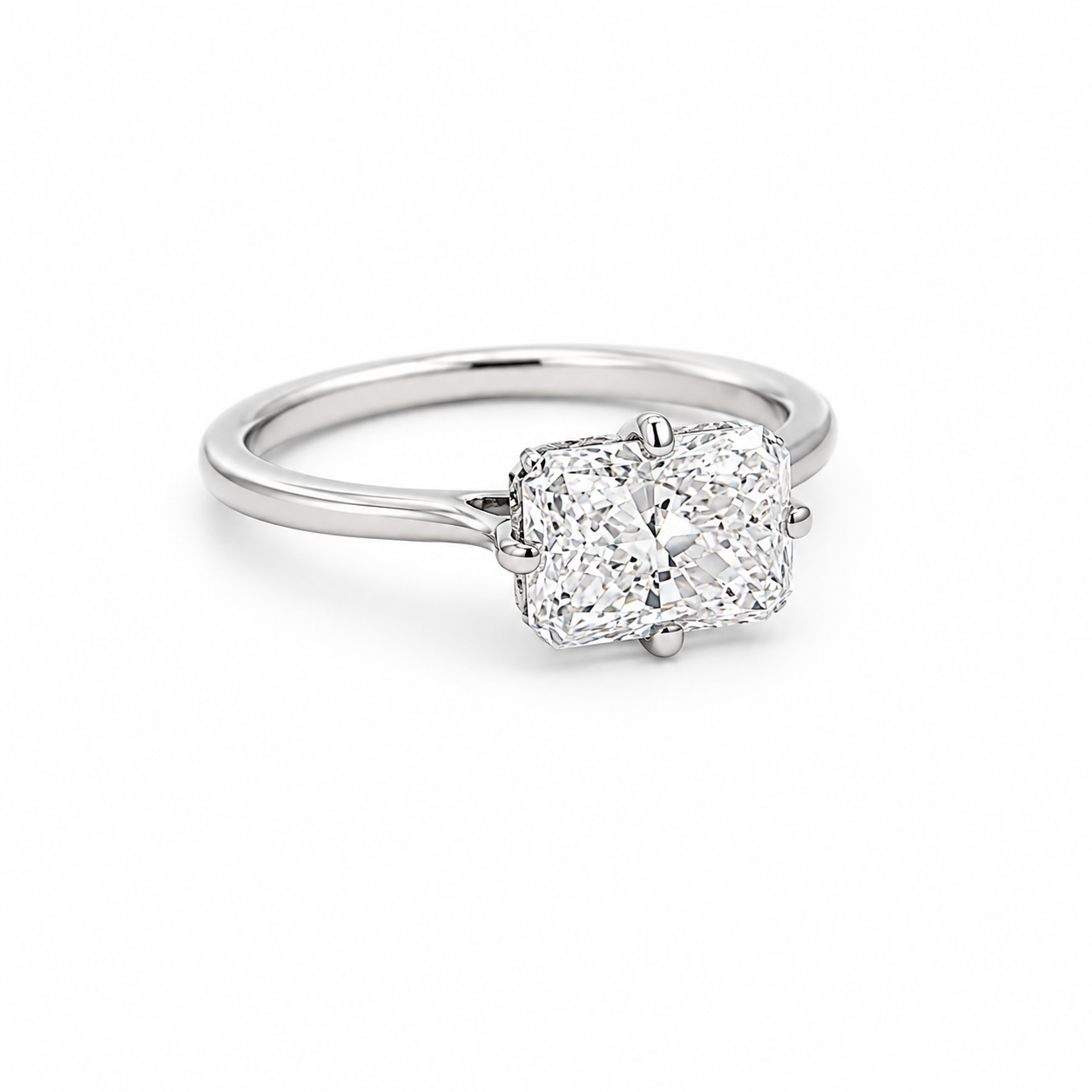 Diamond ring with a cushion-cut diamond on a white background