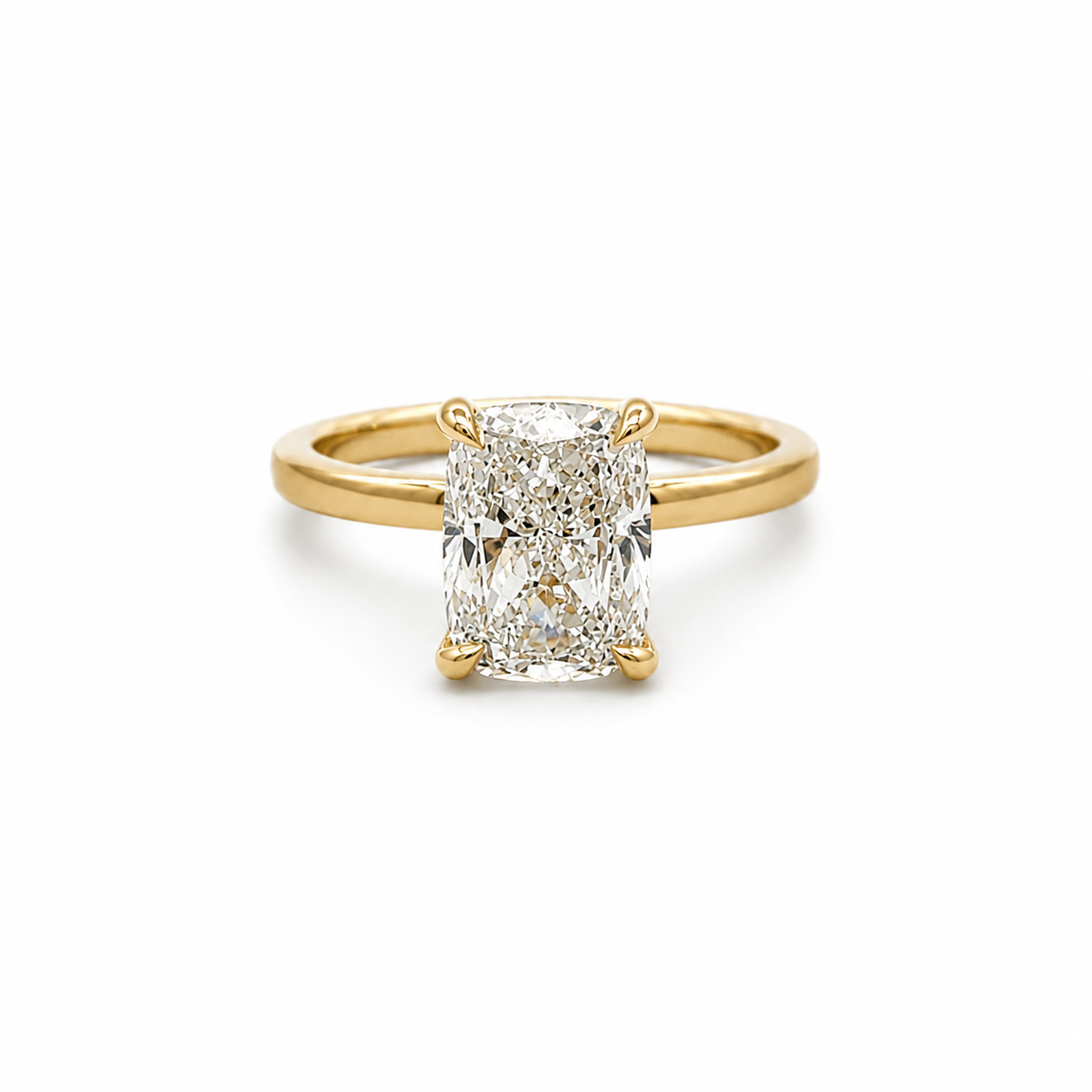 Gold ring with a large diamond on a white background