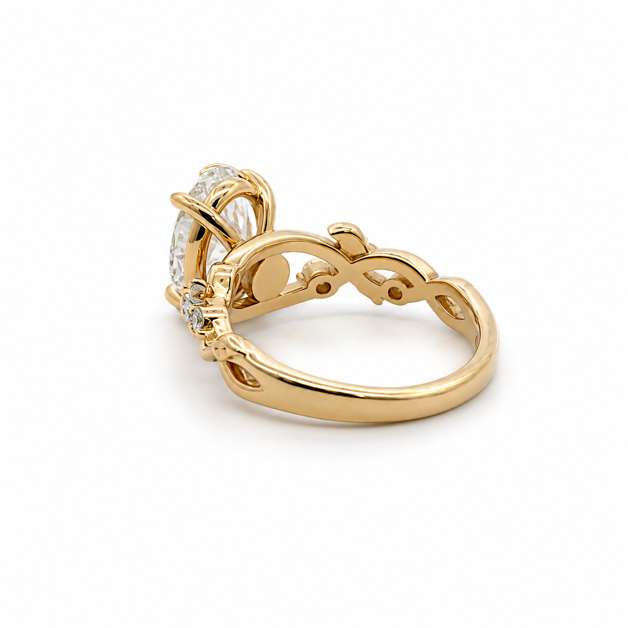Gold ring with diamond accents on a white background