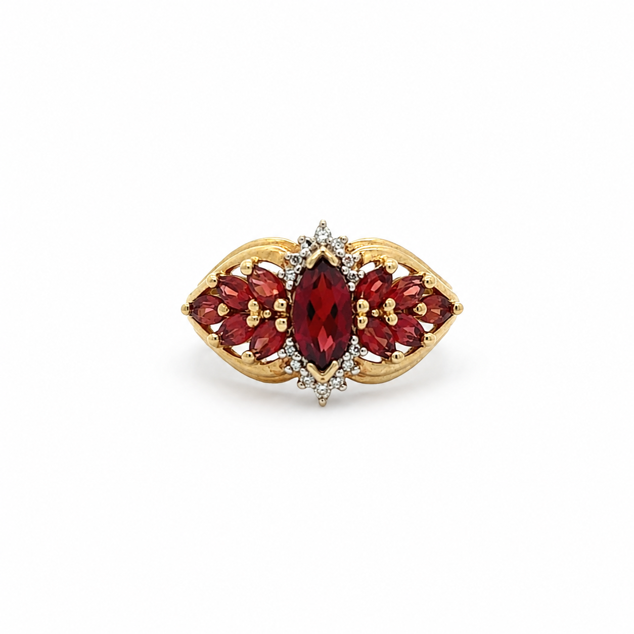 Gold ring with red gemstones on a white background