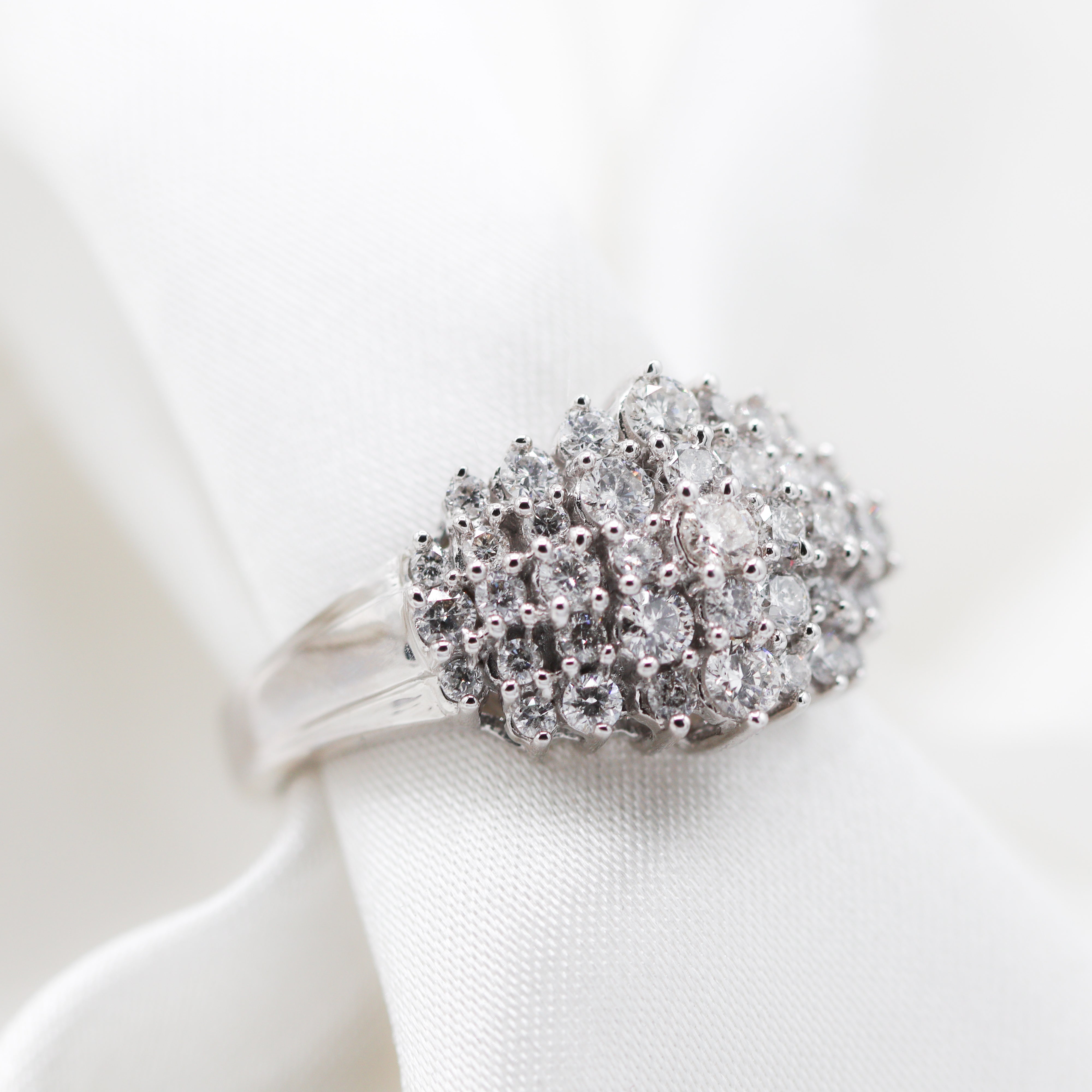 Side View of 10K White Gold 1CTW. Diamond Cluster Cocktail Ring on Satin