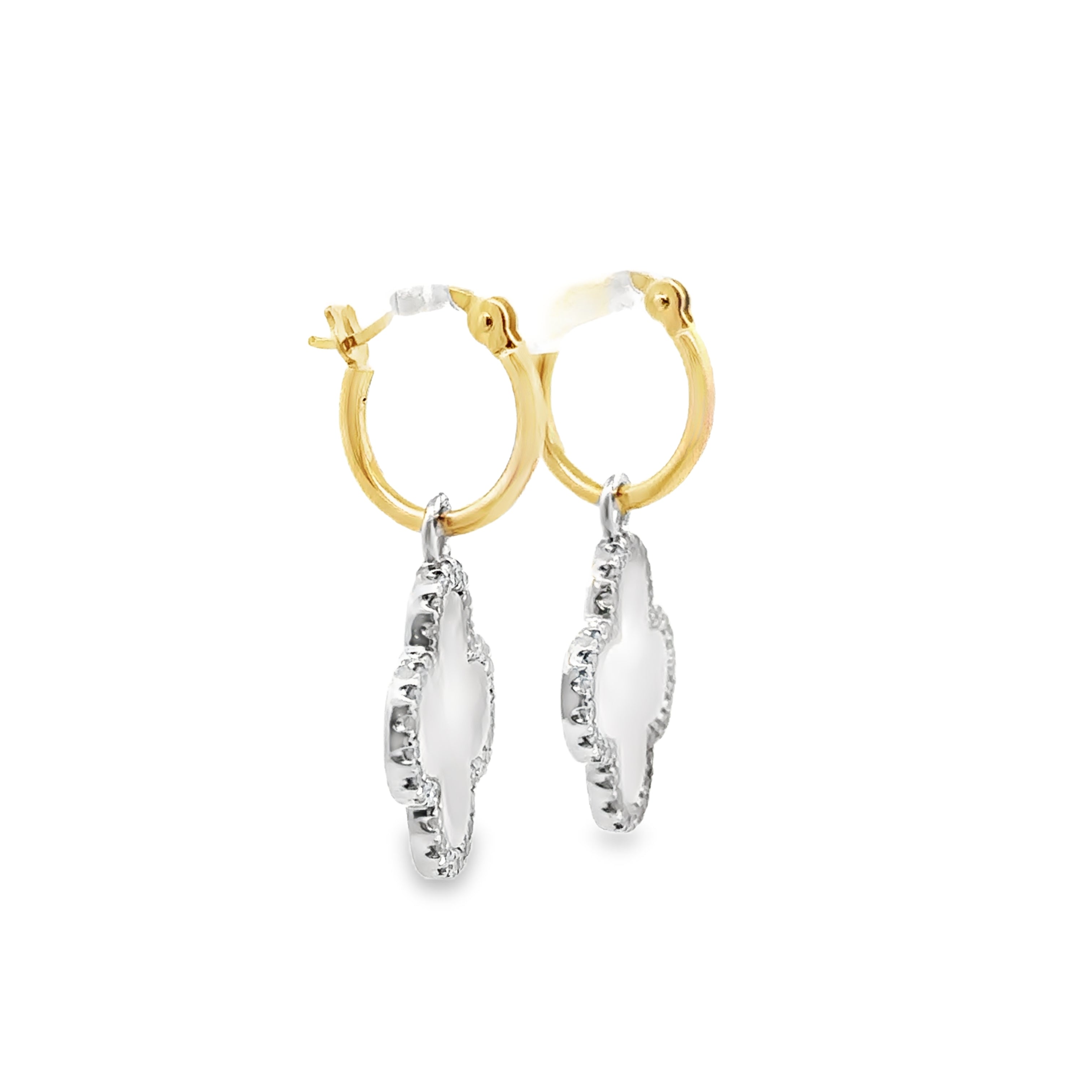 Side view of Mother of pearl and single-cut diamond dangle stud earrings on a white background.