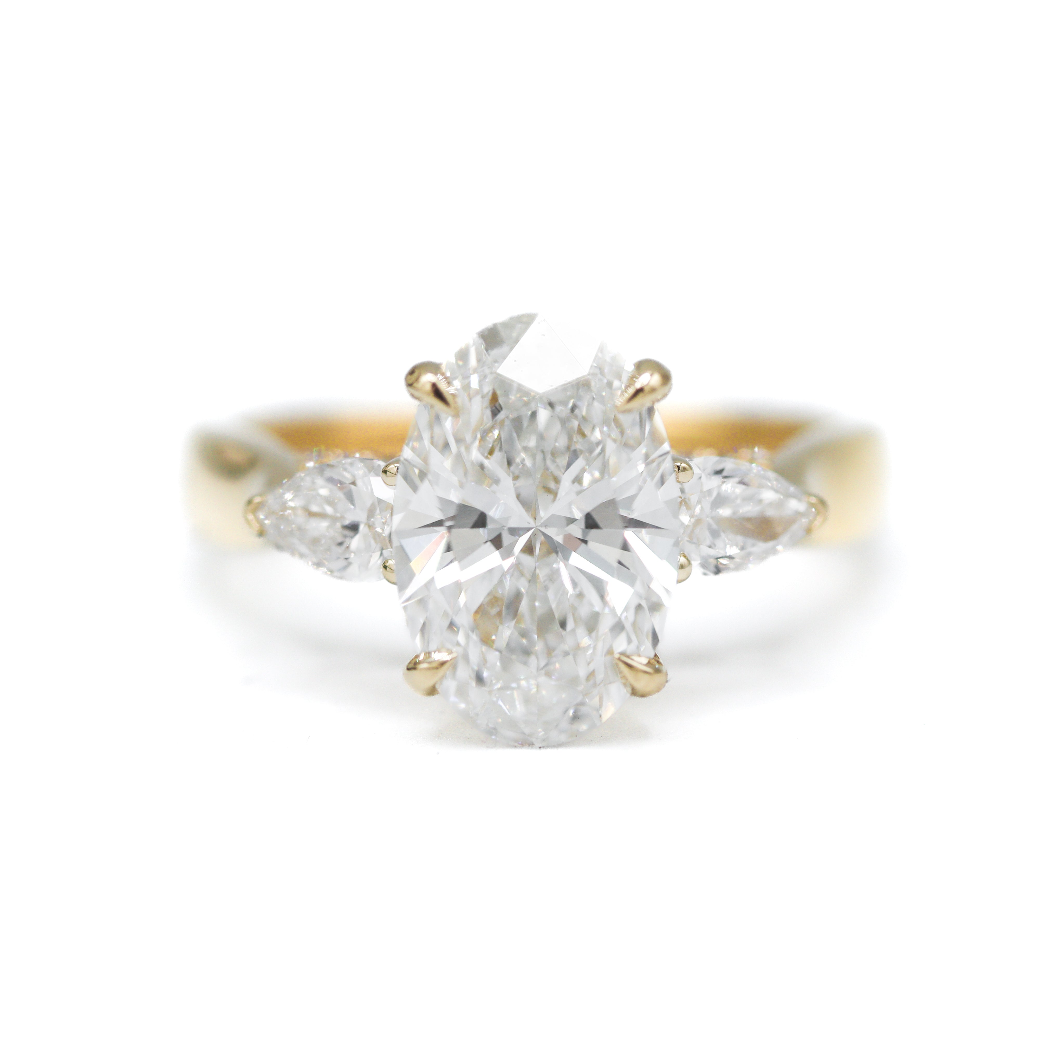 Front view of 14K Yellow Gold 3-2/3CTW. Certified Oval-Cut Lab-Grown Diamond 3-Stone Accented Engagement Ring