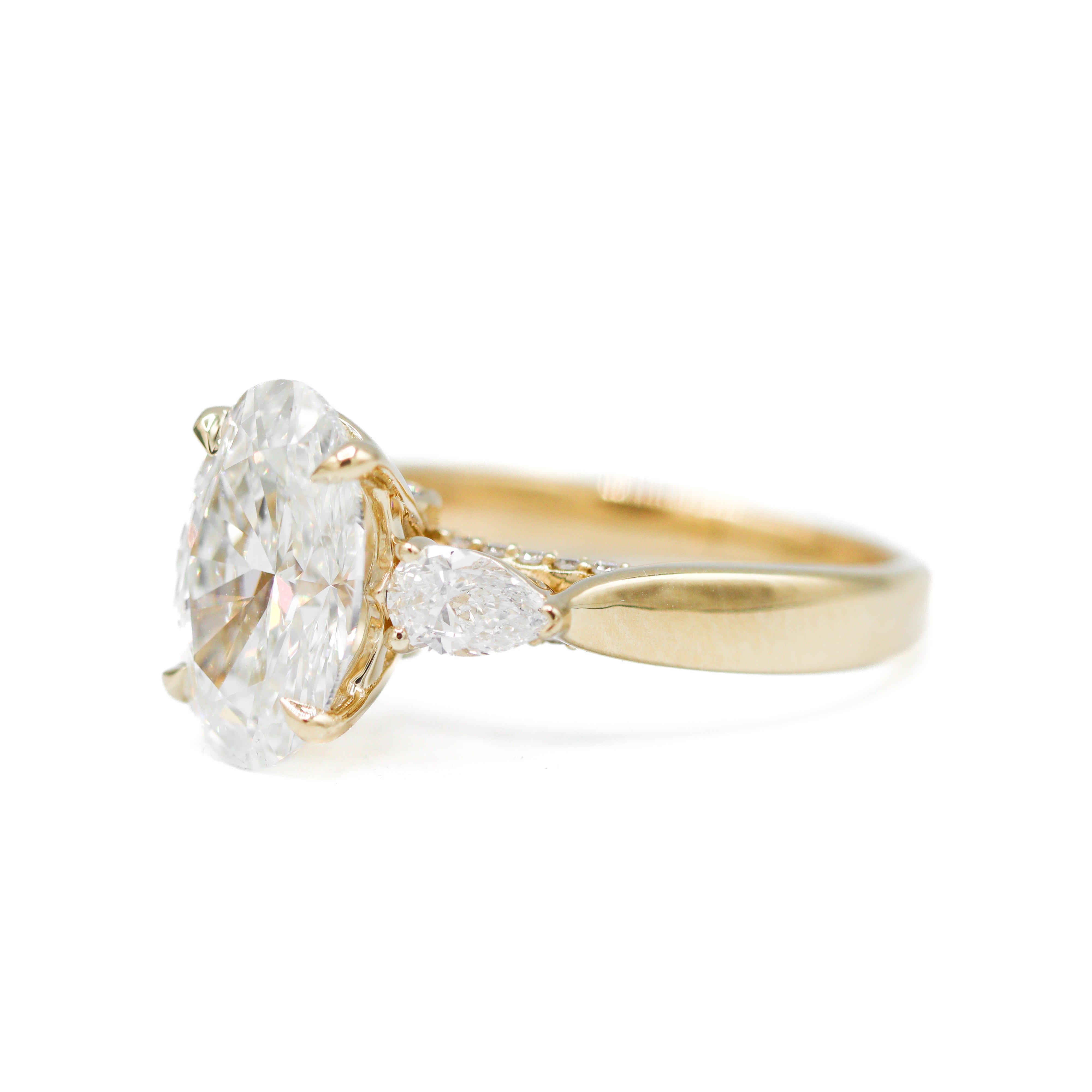 Right side view of 14K Yellow Gold 3-2/3CTW. Certified Oval-Cut Lab-Grown Diamond 3-Stone Accented Engagement Ring
