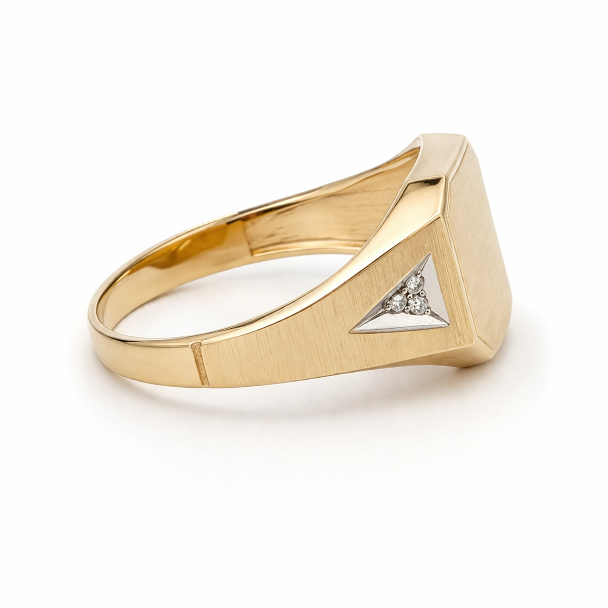 Gold ring with a diamond triangle on a white background