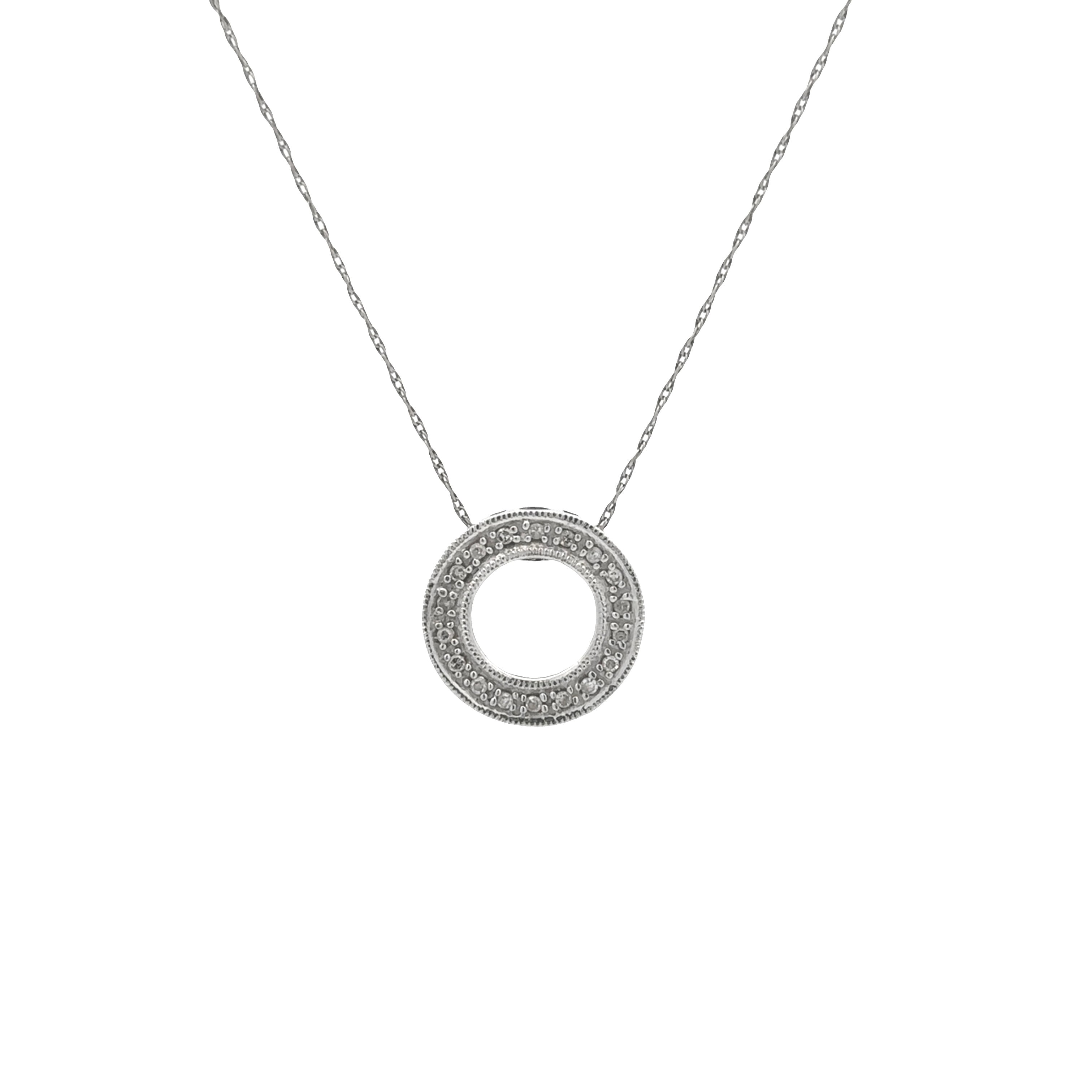 A silver-tone necklace featuring a double-ring pendant paved with small clear stones, suspended from a delicate chain against a plain white background.