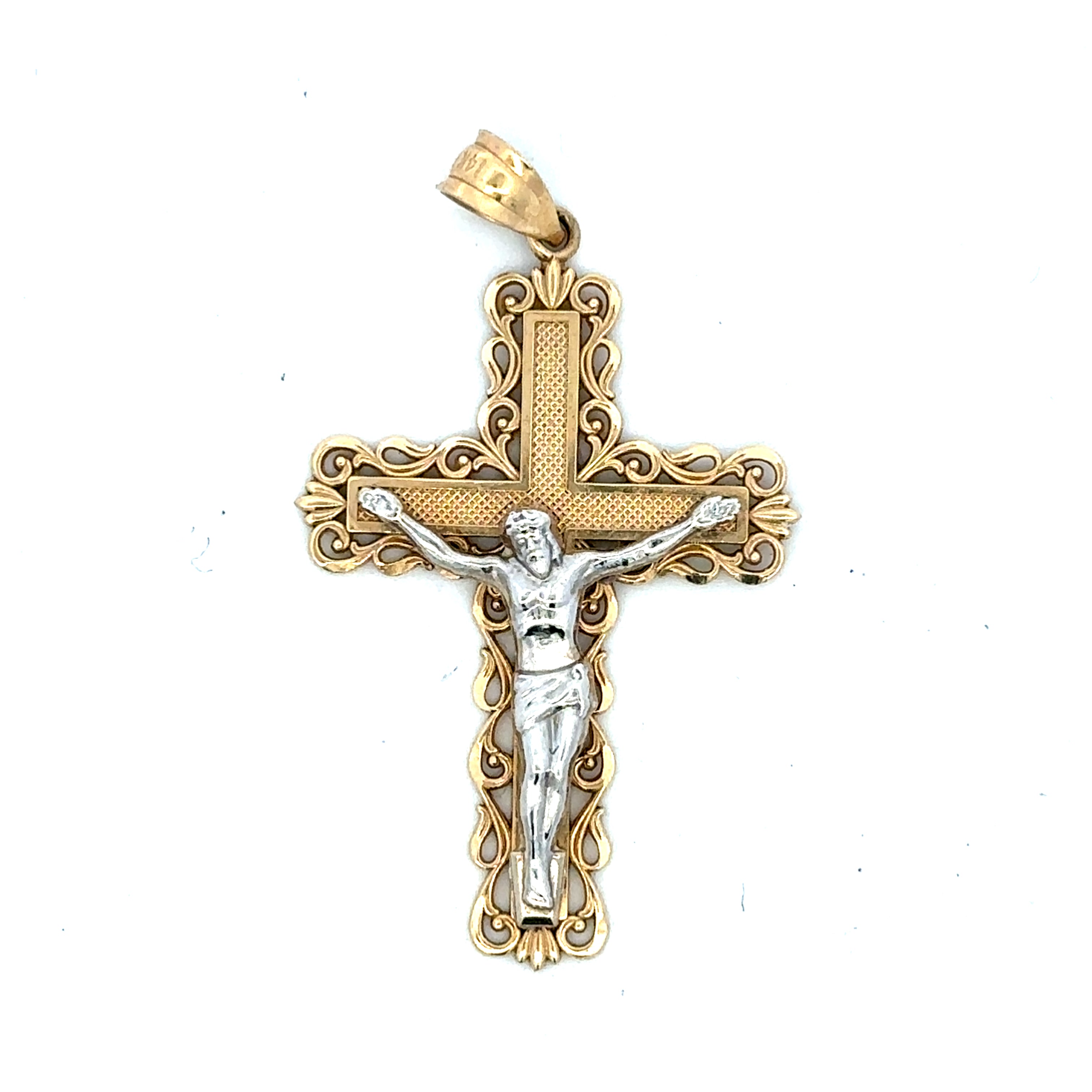 A two-tone crucifix pendant featuring a silver-toned corpus of Jesus Christ on an ornate, filigree gold-toned cross with a textured center panel and a bail at the top.