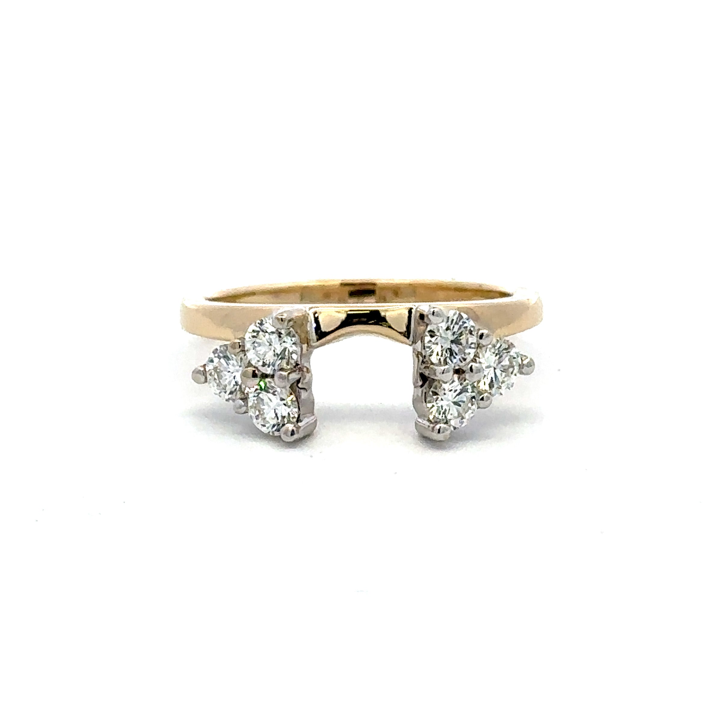 A yellow gold ring with diamond clusters on either side of a central gap, photographed on a plain white background.