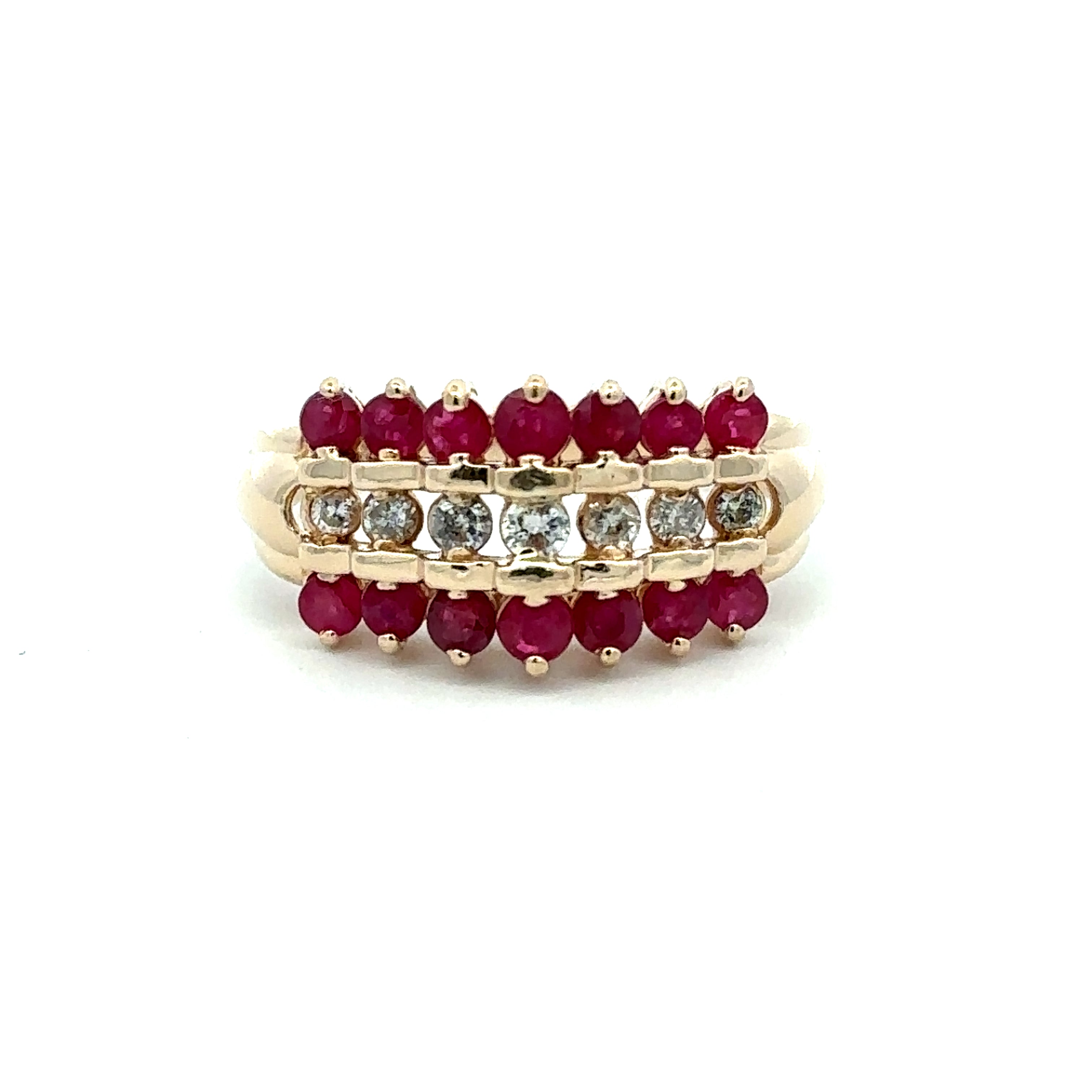 A yellow gold eternity ring featuring three rows of round-cut gemstones: a top row of deep red rubies, a middle row of clear diamonds, and a bottom row of red rubies, set against a plain white background.