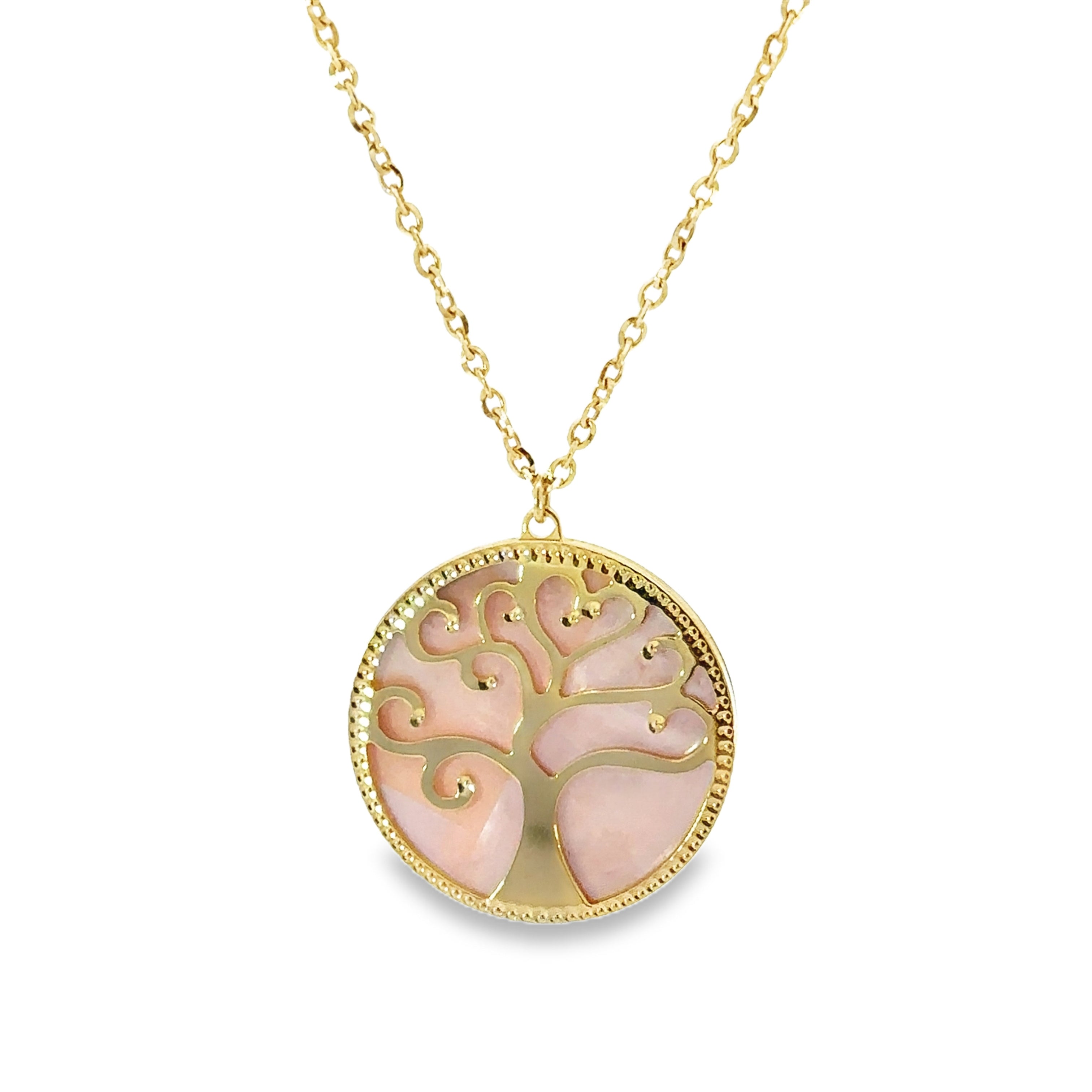 Round Pink Mother Of Pearl set in a 14K yellow gold mounting with a yellow gold tree of life motif on top. Hanging in front of a white background.