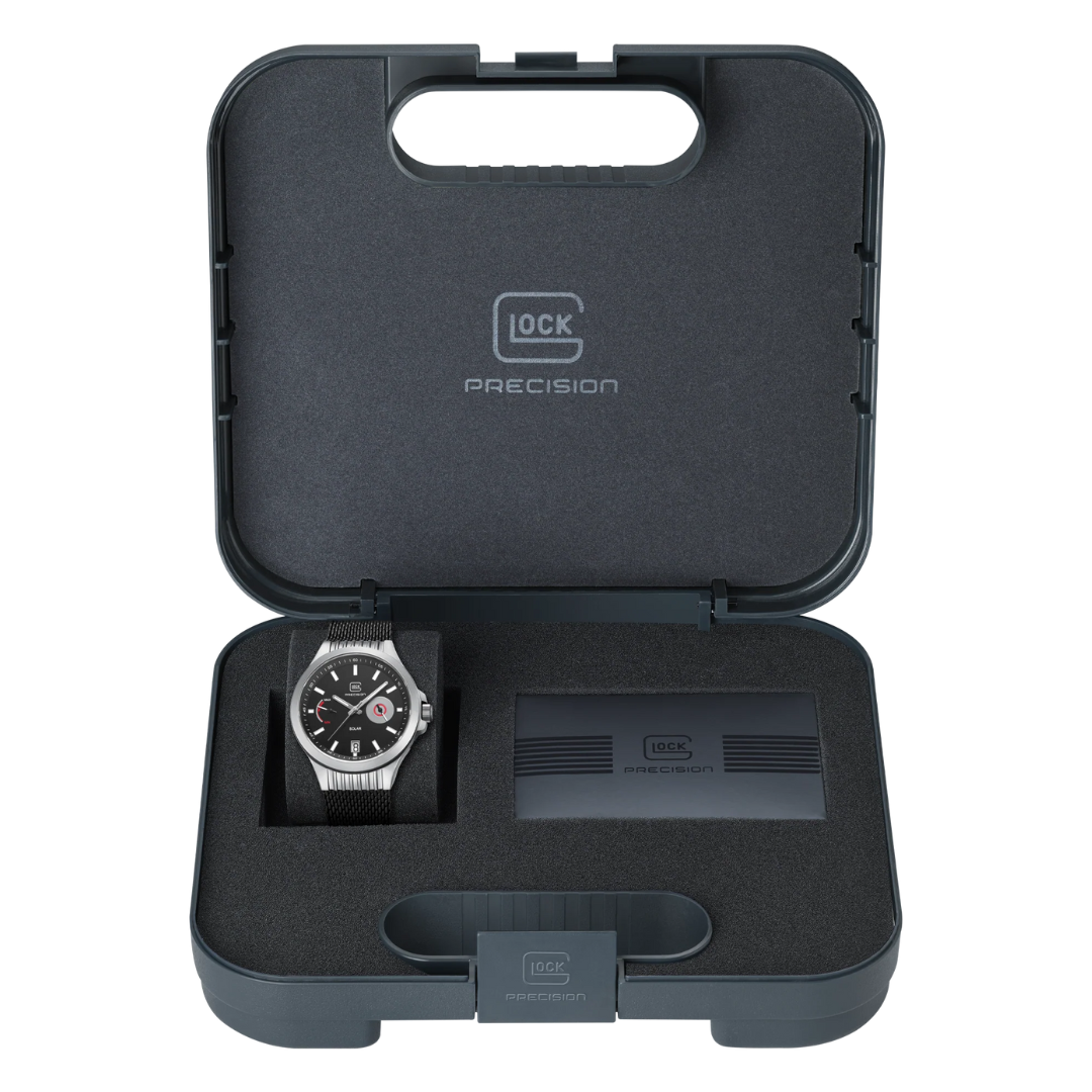 Picture of GLOCK Silver Tone Stainless Steel Solar Watch With Black Silicone Band, in the case it comes in, on a tranparent background.