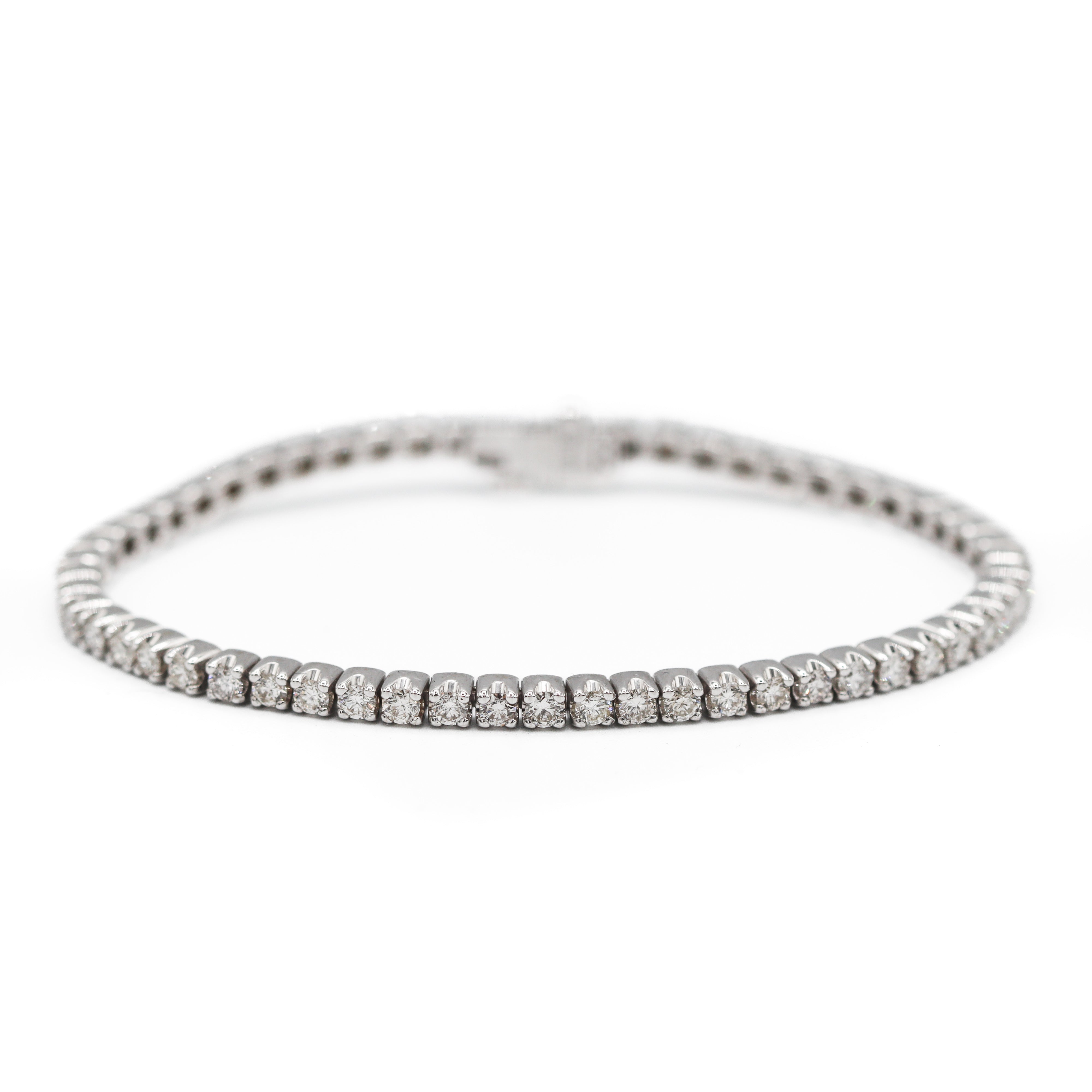 Zoomed out view showing the diamonds of this 14K White Gold 4 carat total weight natural diamond tennis bracelet on a white background.