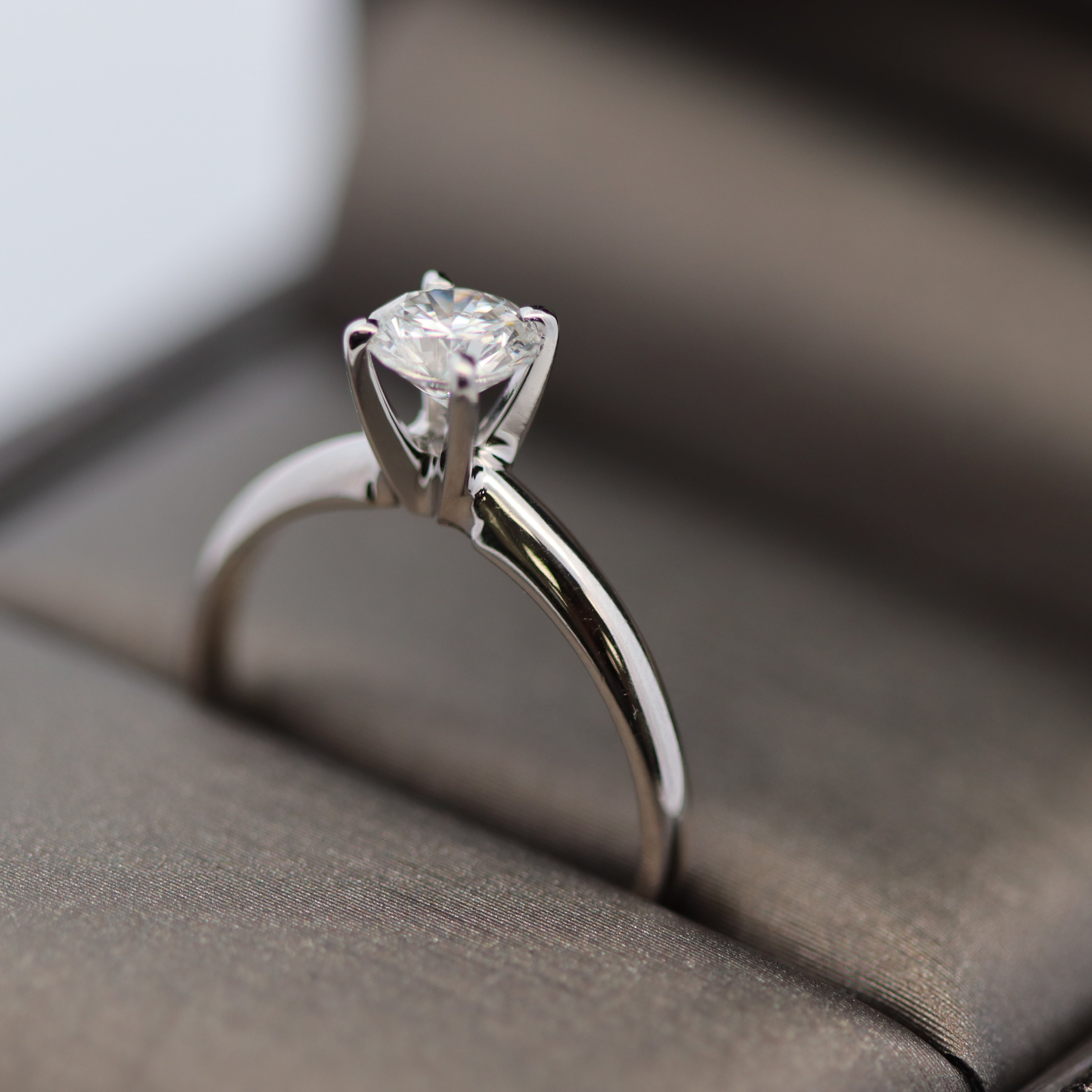 Diamond ring on a soft fabric surface