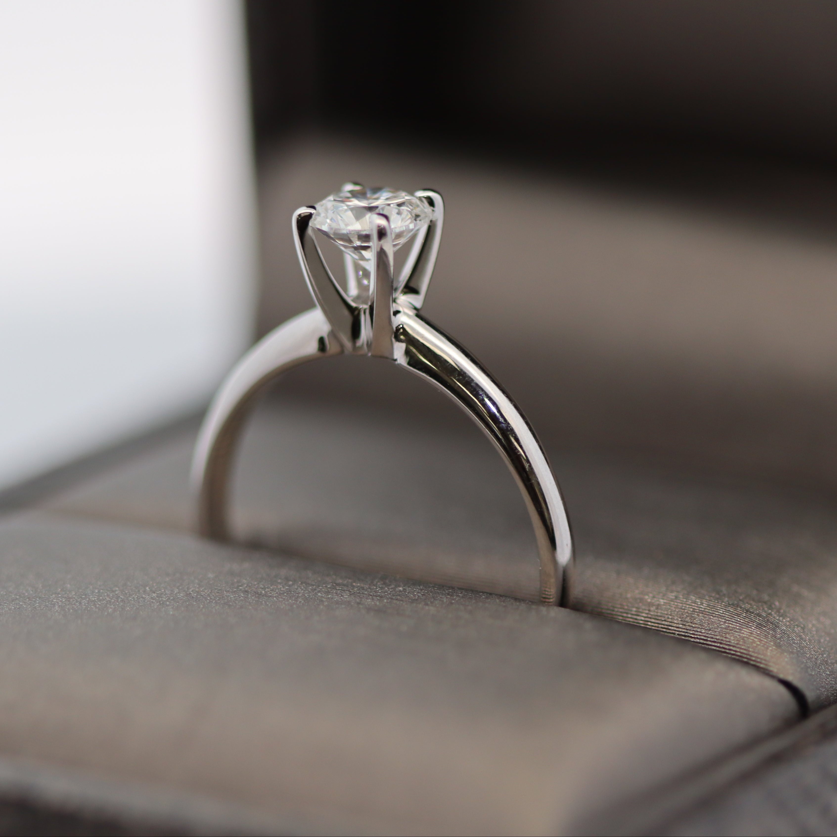 Diamond ring on a soft surface with a blurred background