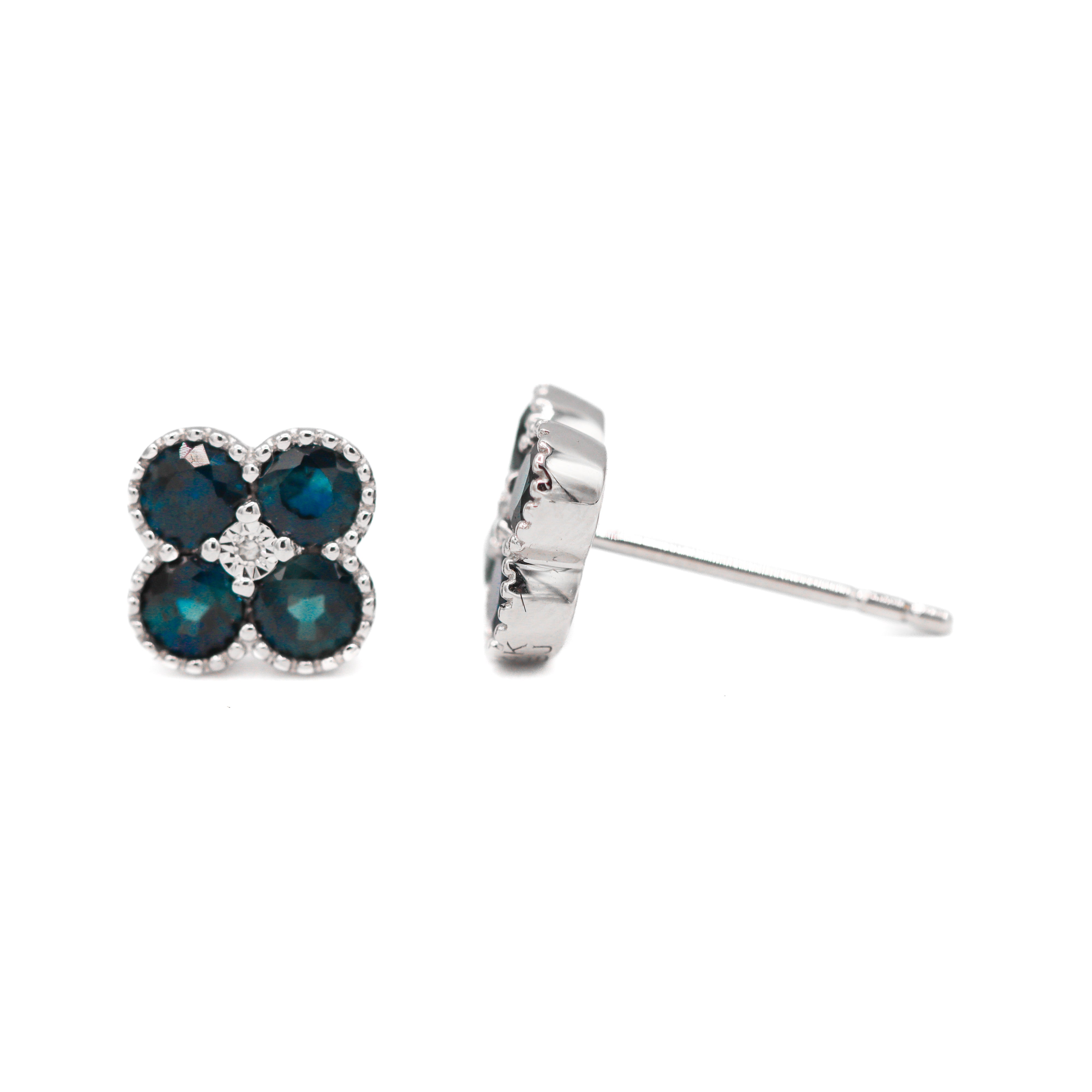 Left front-facing and right side view of 14K White Gold 1CTW. Sapphire & 1/50CTW. Diamond Clover Stud Earrings on a white background.