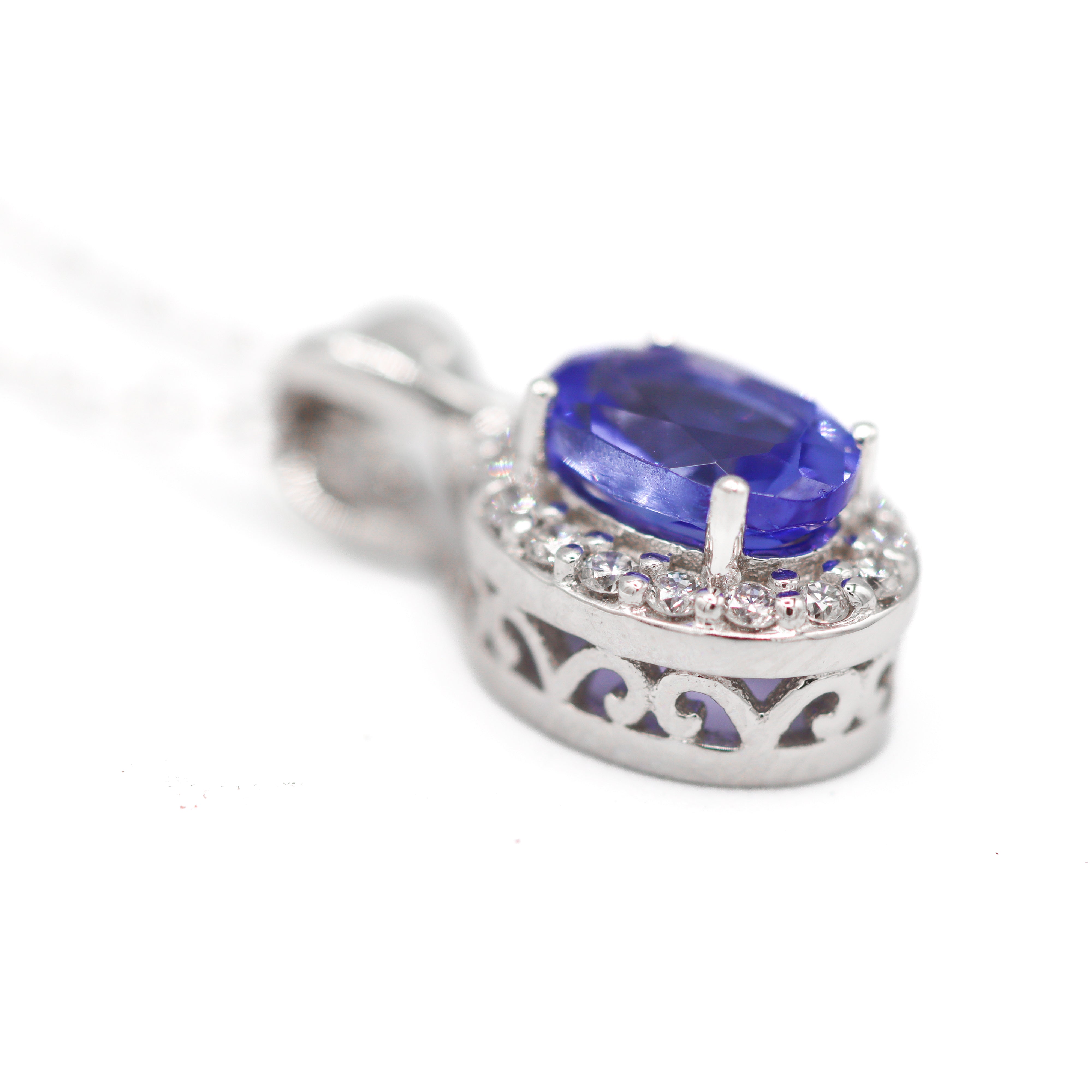 14K White Gold Tanzanite and 1/10CT. Diamond Halo Oval Pendant Necklace