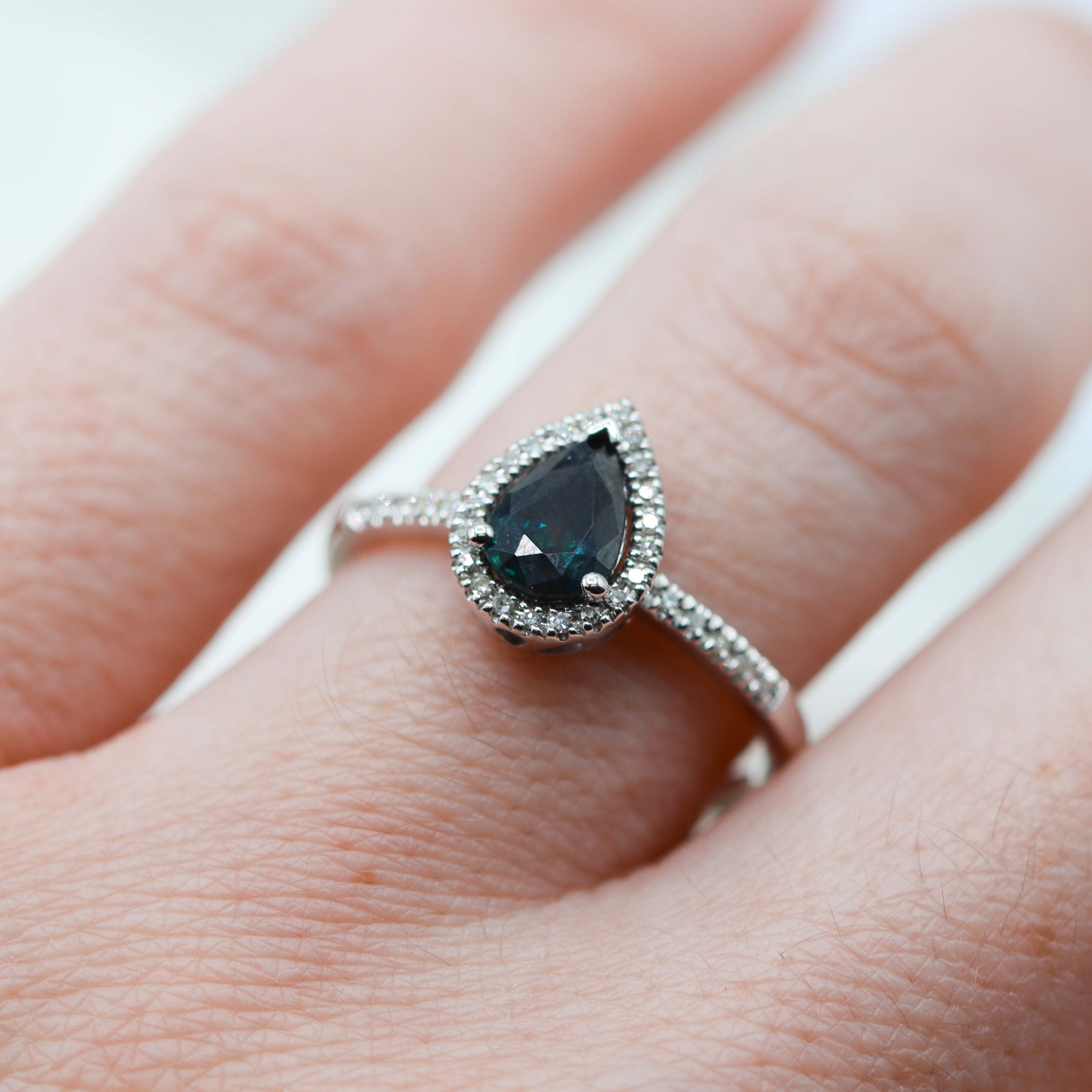 14K White Gold Pear-Cut Sapphire & 1/6CTW. Diamond Halo Ring