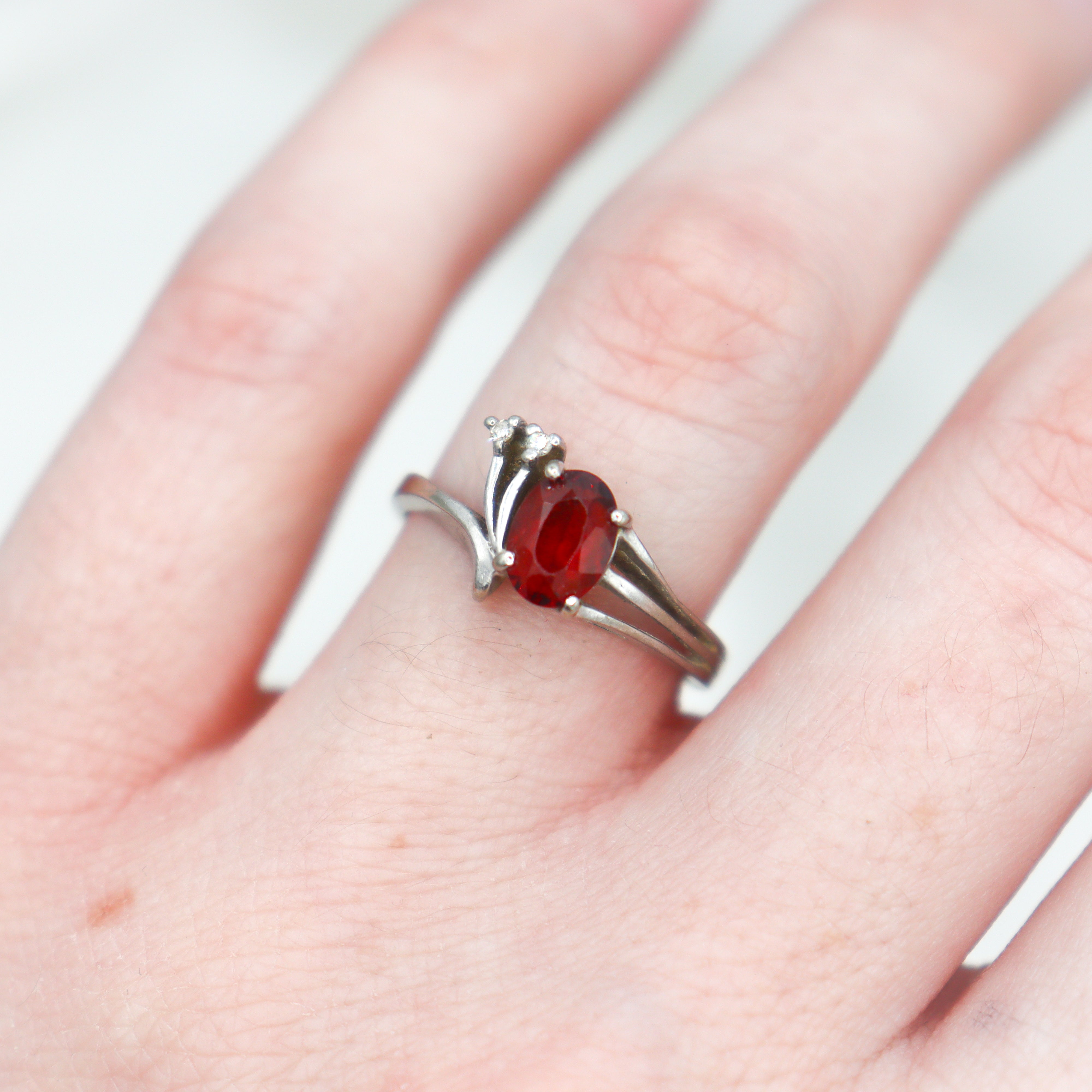 Estate 10k white gold garnet and diamond ring