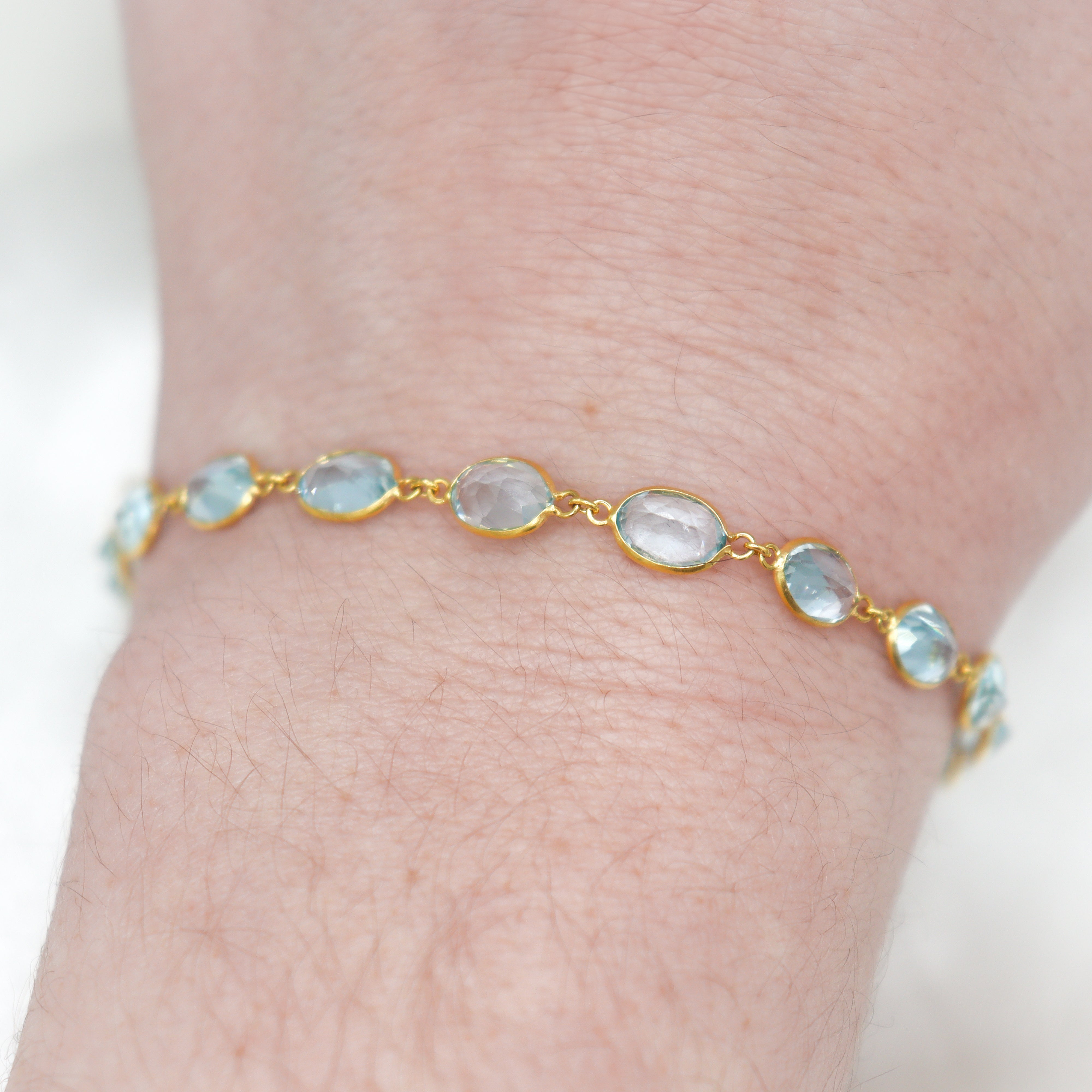 Estate Collection: 10K Yellow Gold Oval-Cut Sky Blue Topaz 7" Bezel-Set Link Bracelet