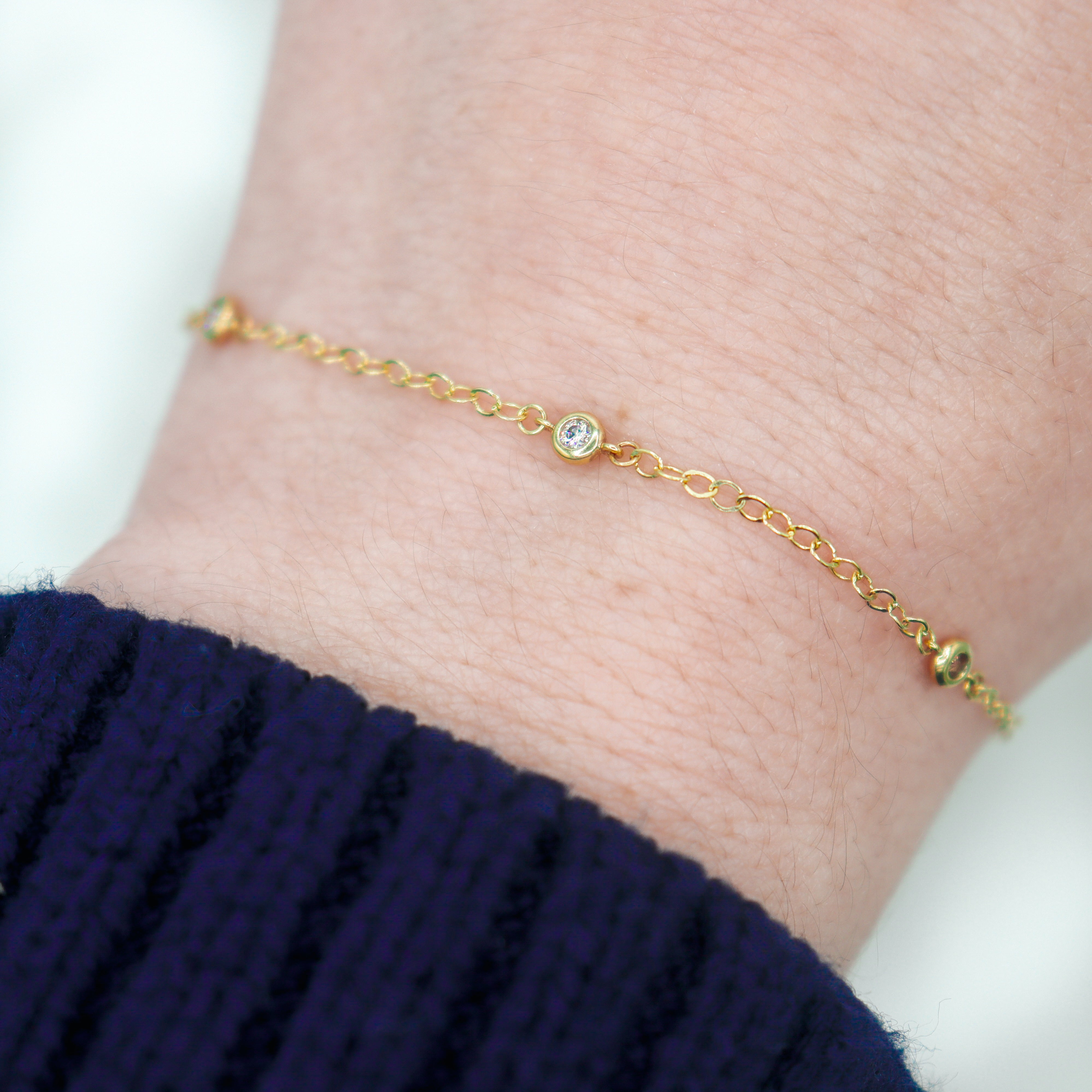 14K Yellow Gold 1/8CTW. Diamond Station Bracelet on a wrist