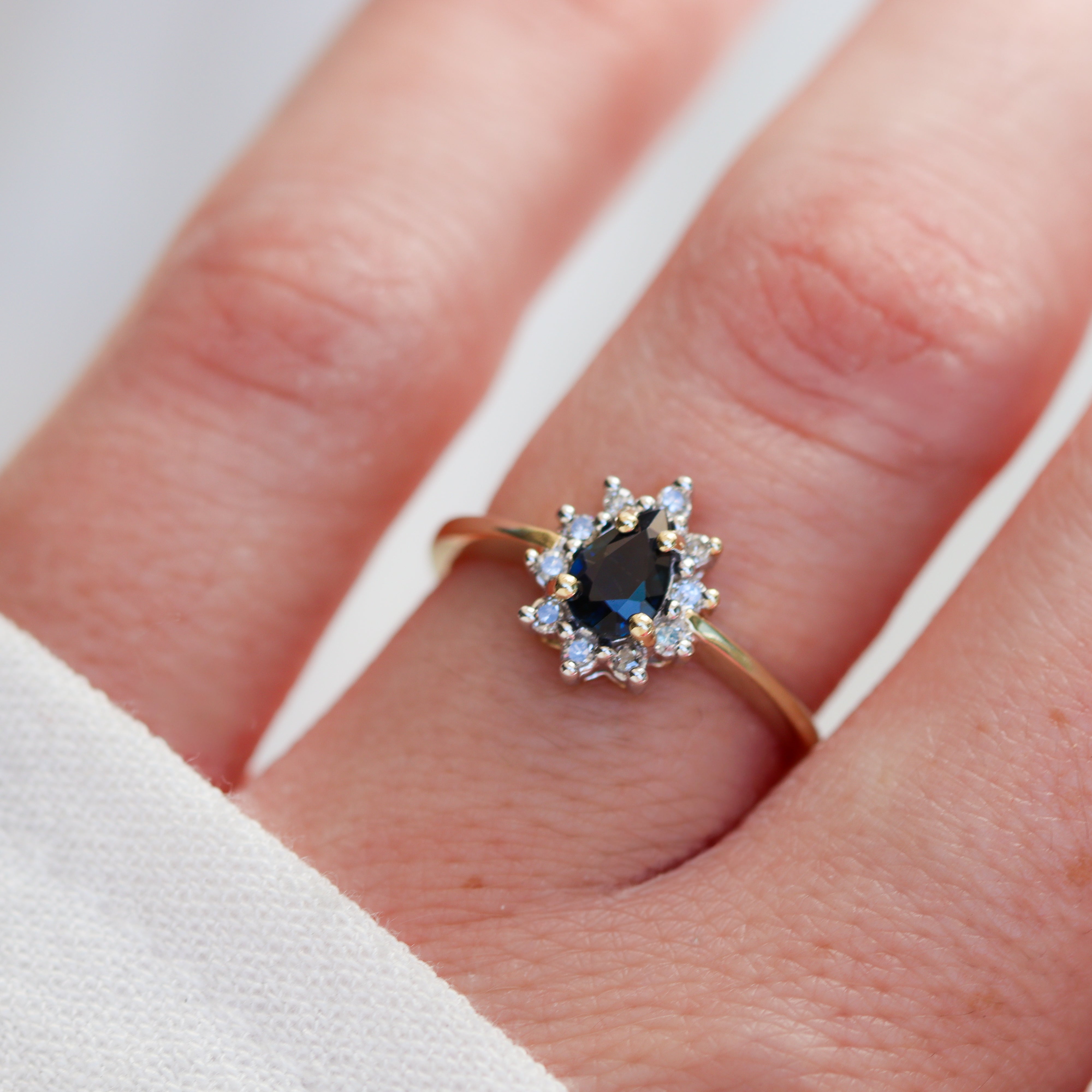 Model View Estate Collection: 10K Yellow Gold Pear-Shape Sapphire & Diamond Accented Halo Ring