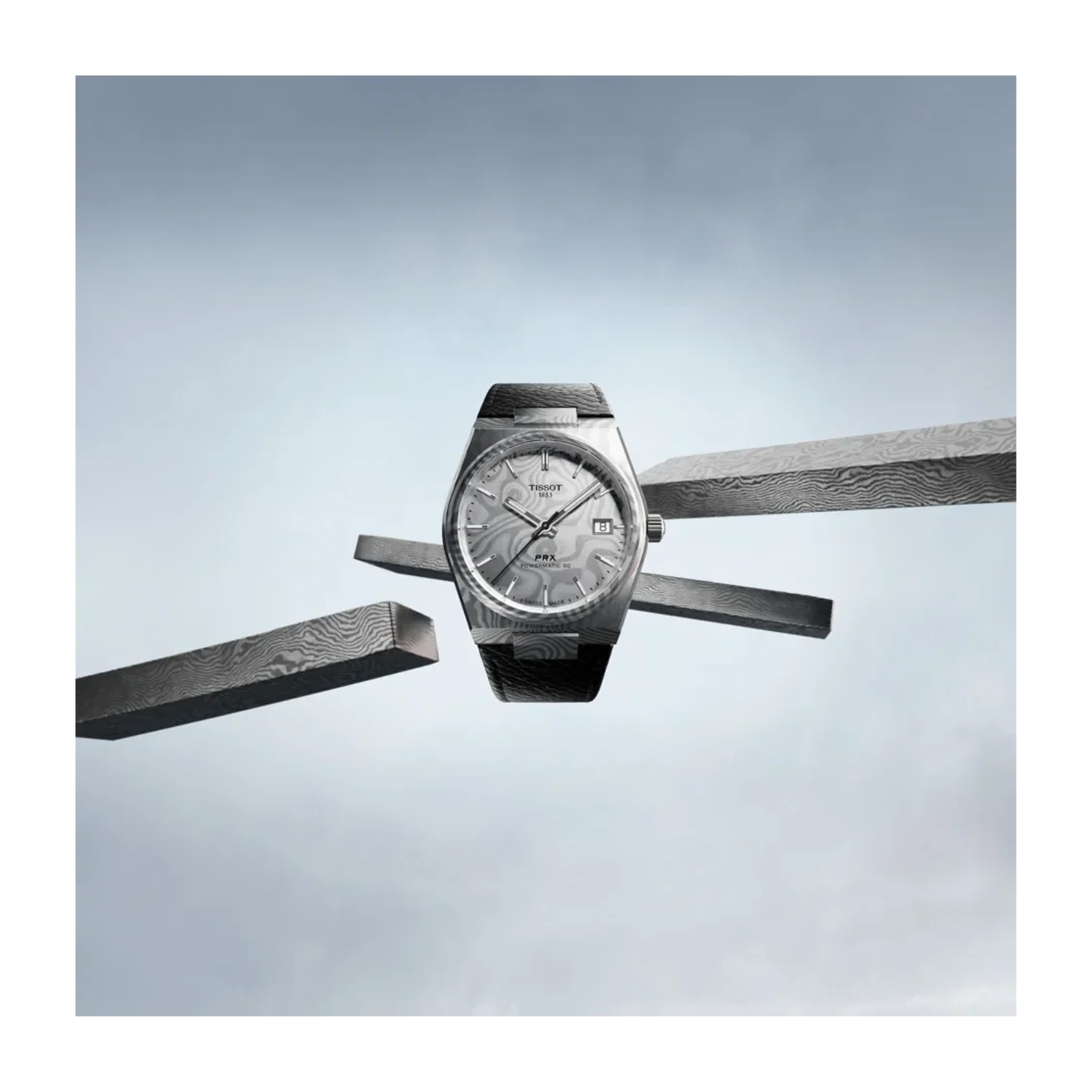 A wristwatch with a silver-toned case and textured gray dial, suspended horizontally between two dark bars against a pale blue-gray background.