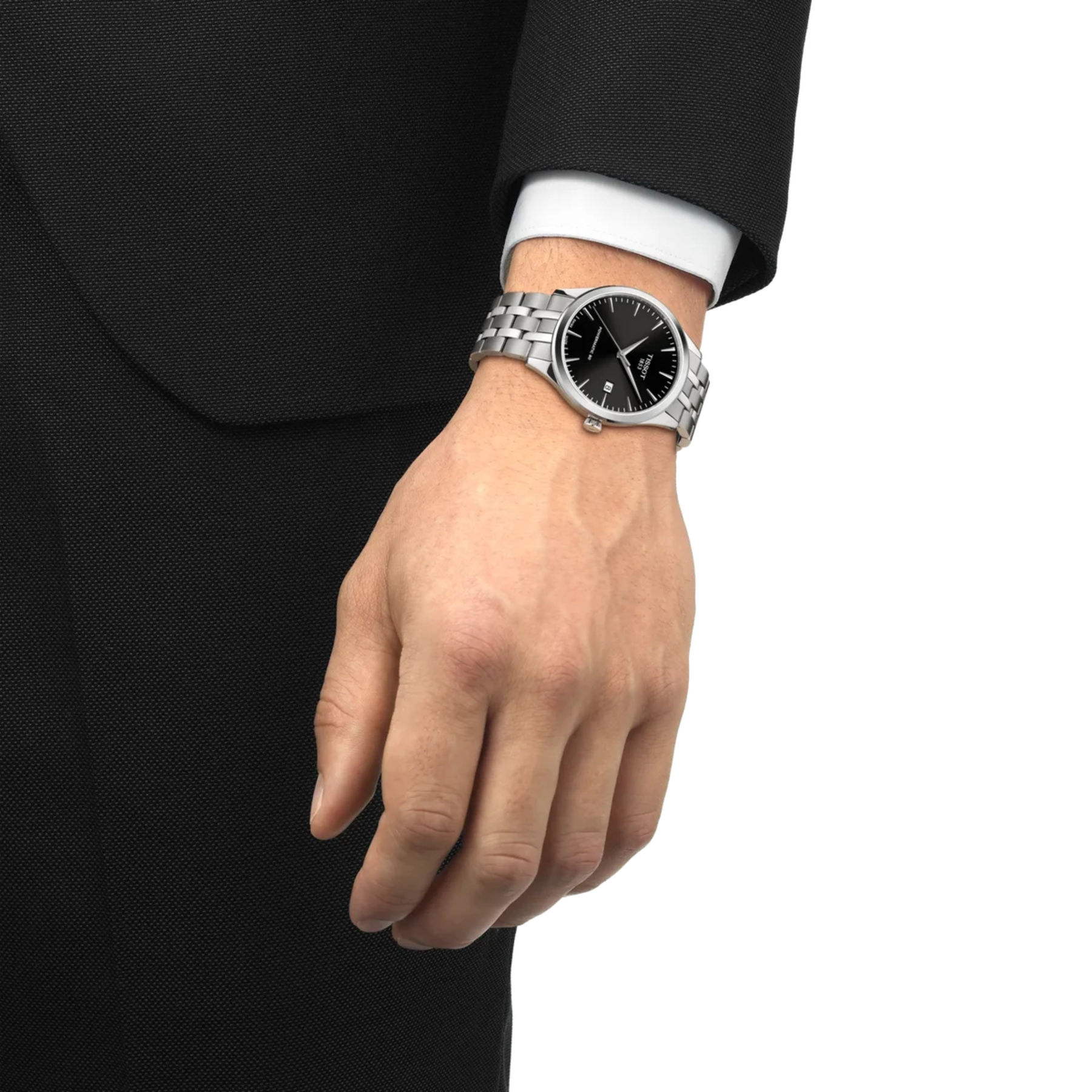 Hand wearing a silver watch with a black face on a white background