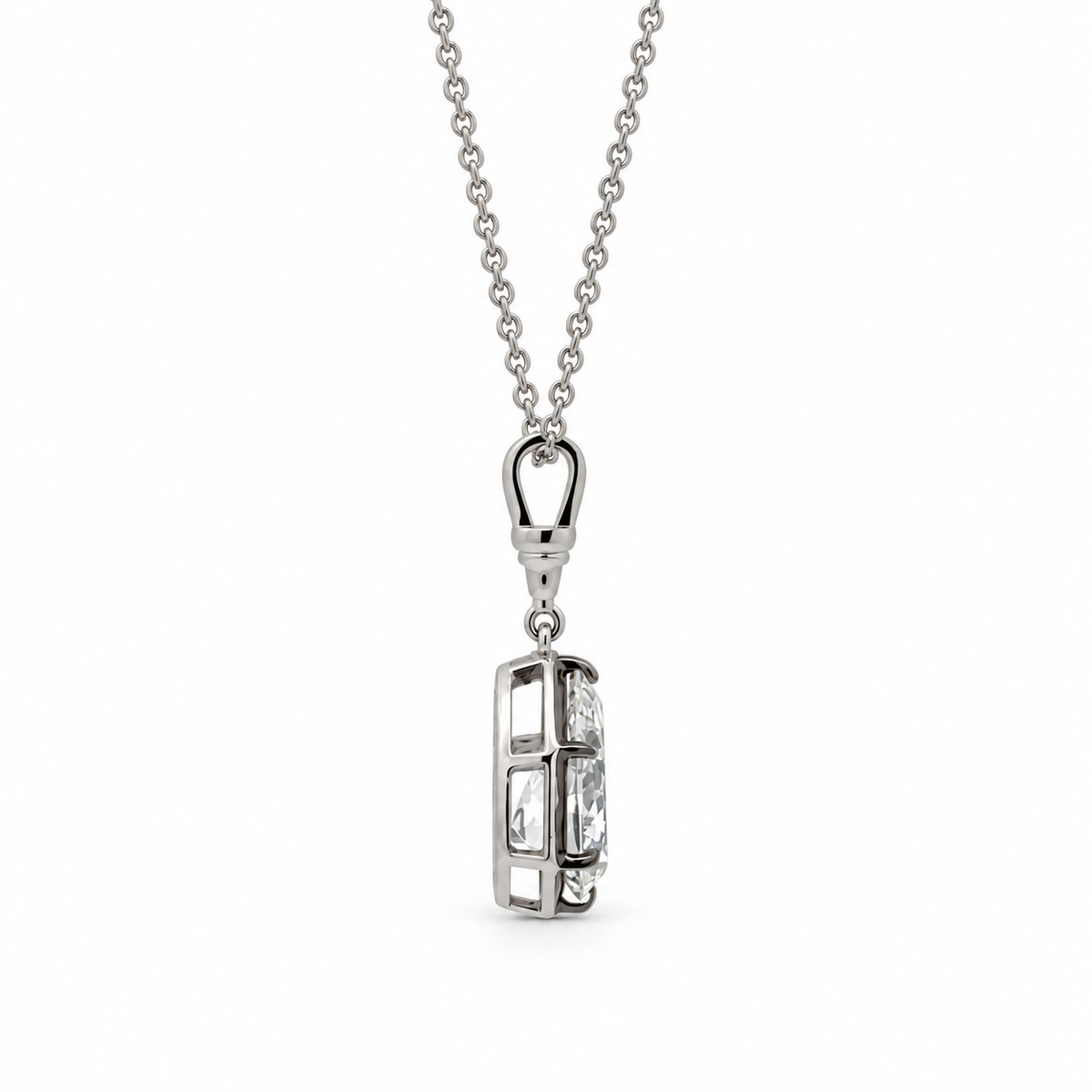 Side profile of the 14K white gold pear diamond pendant showing the prong setting and open basket.